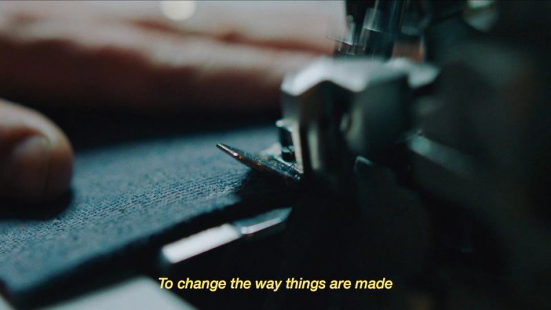 Close-up of sewing machine needle stitching fabric on a Nike project.
