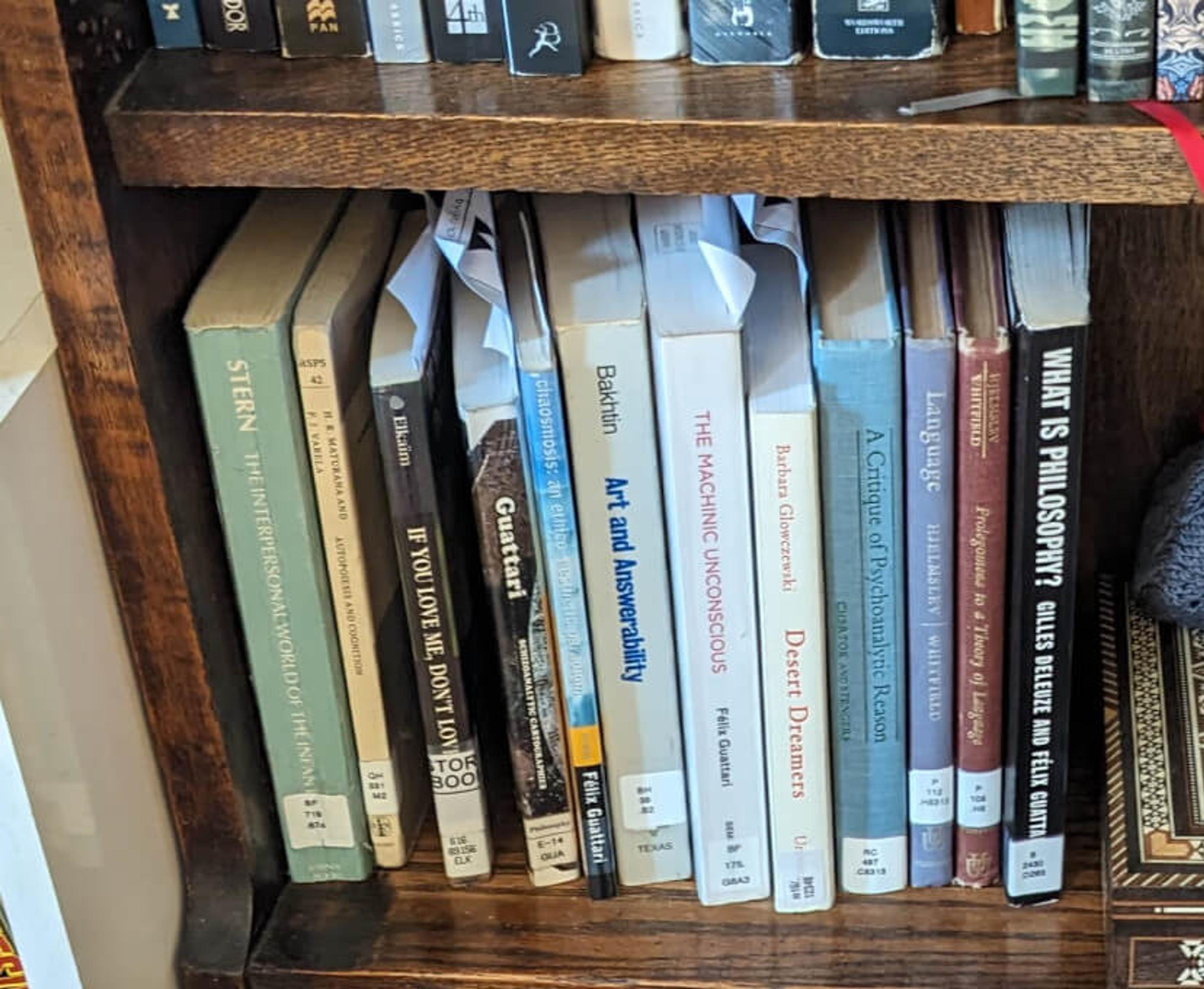 Books containing almost all the references to Ch1 of Guattari's Chaosmosis, standing in a row in order on my bookshelf, with their interlibrary loan tickets sticking out of them