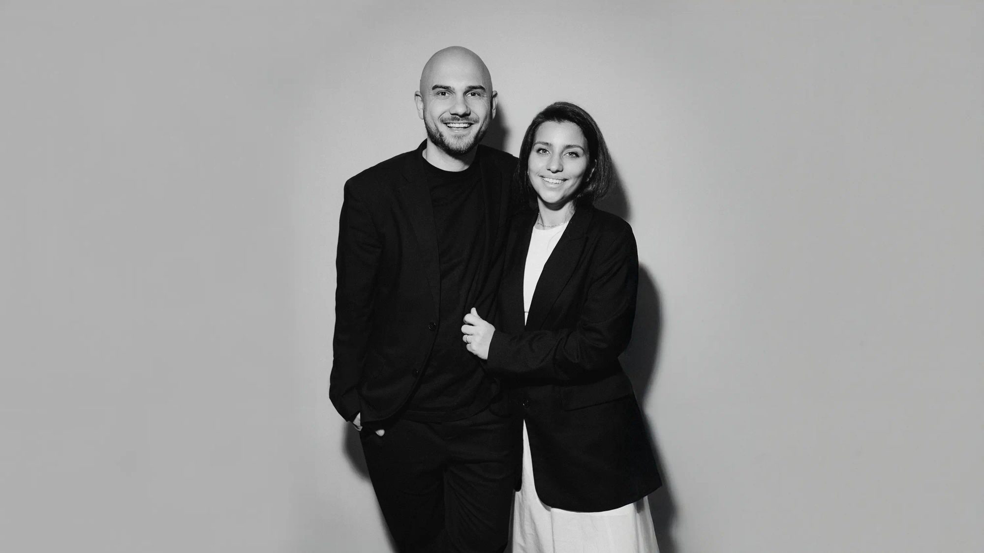 Anton and Sabina, the wedding videographers behind YASIROV Films, standing together