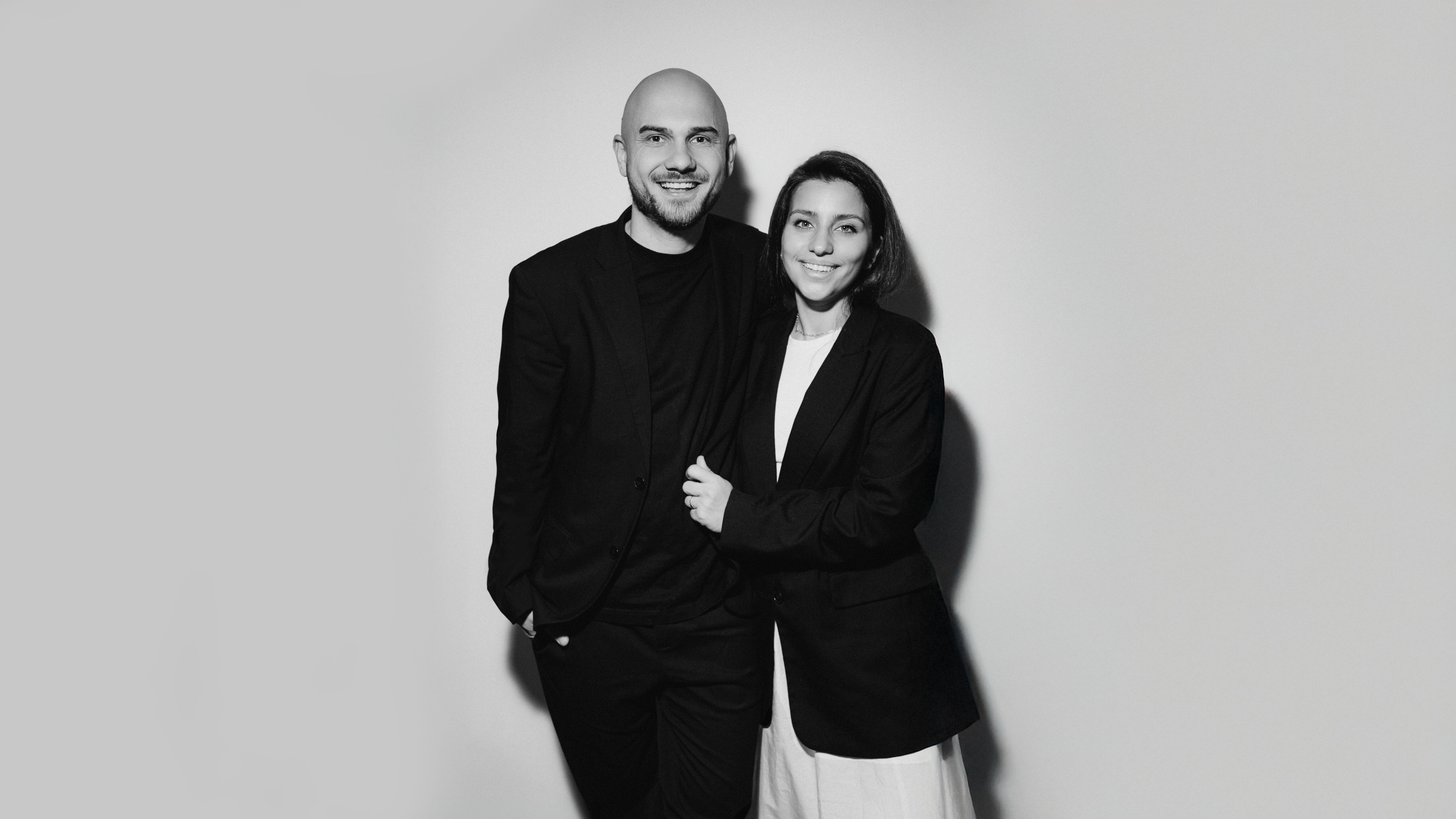 Anton and Sabina, the wedding videographers behind YASIROV Films, standing together