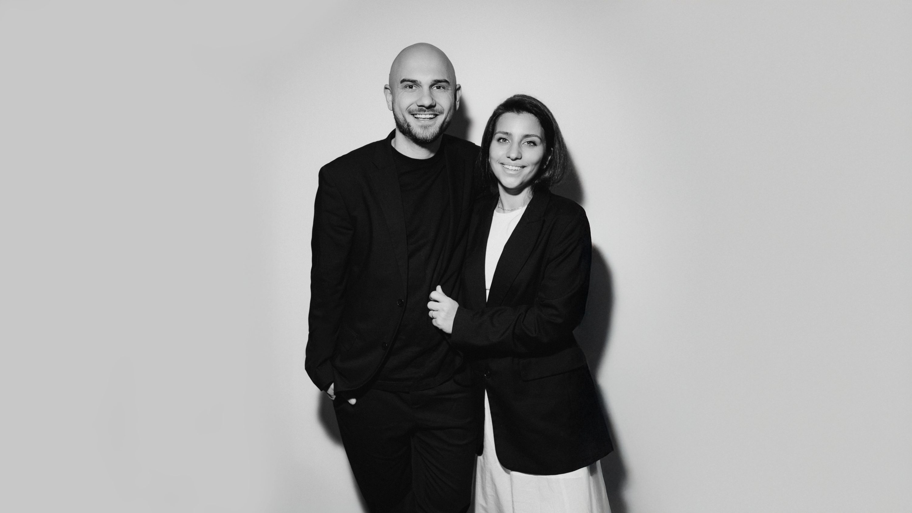 Anton and Sabina, the wedding videographers behind YASIROV Films, standing together