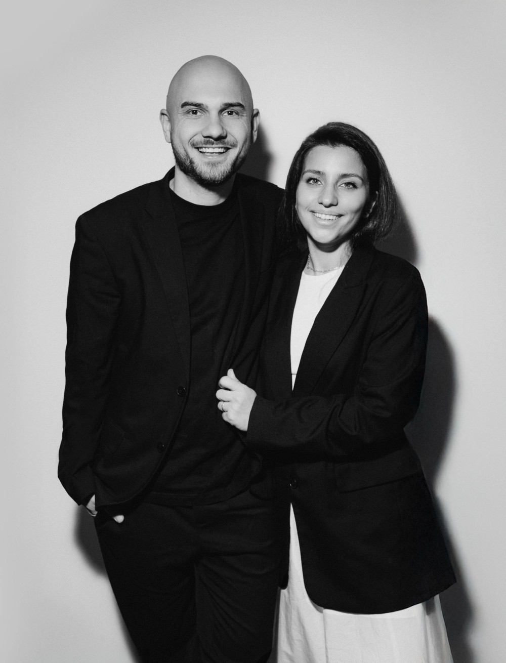 Anton and Sabina, the wedding videographers behind YASIROV Films, standing together