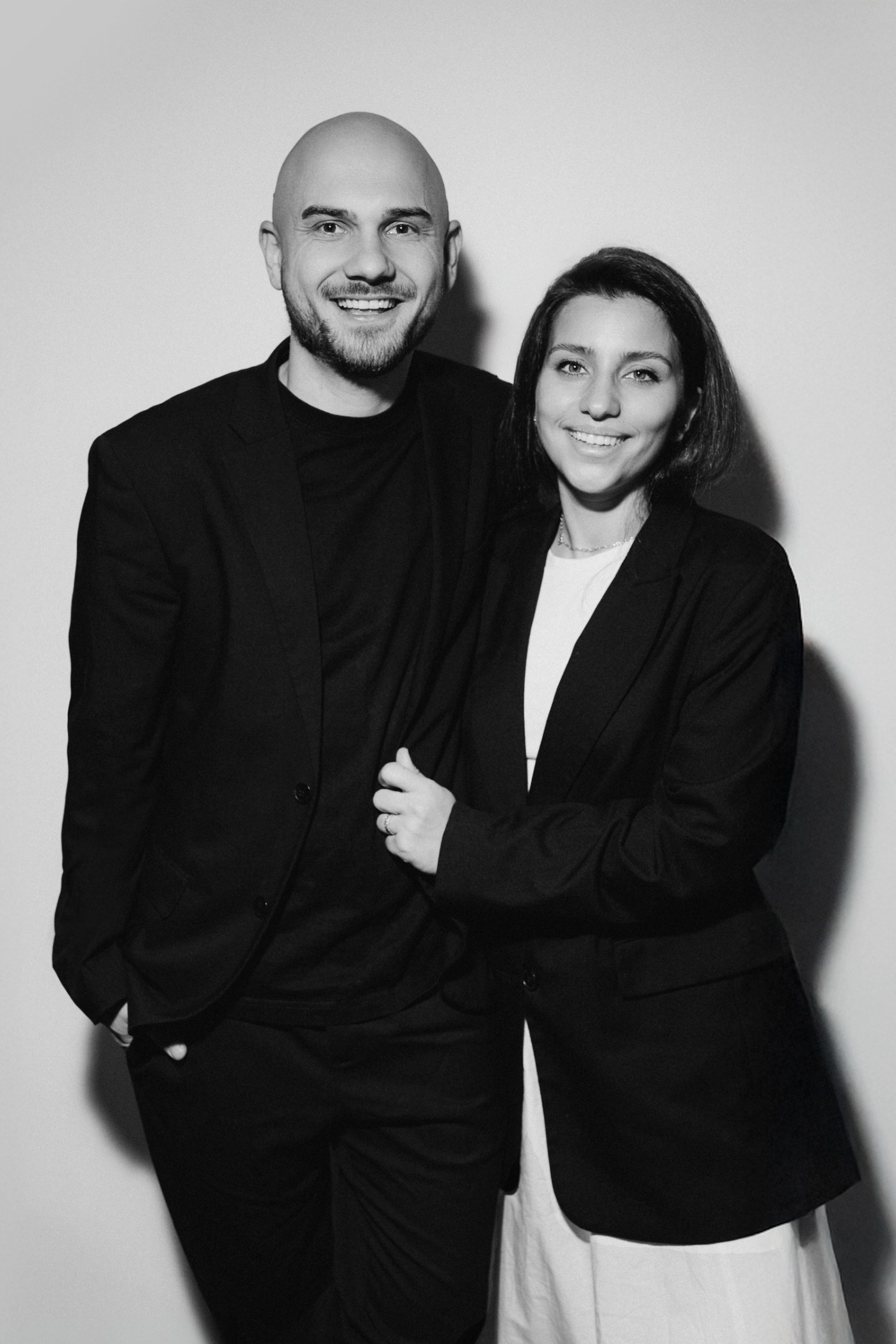 Anton and Sabina, the wedding videographers behind YASIROV Films, standing together