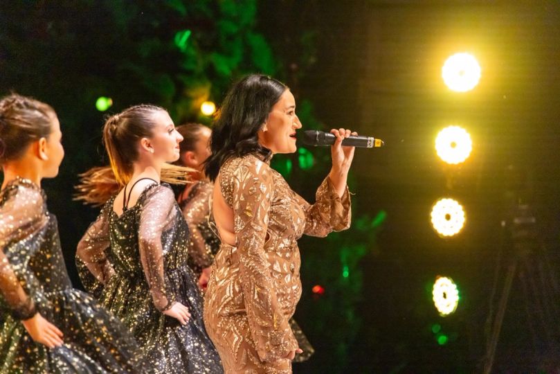 Singer and dancers on stage