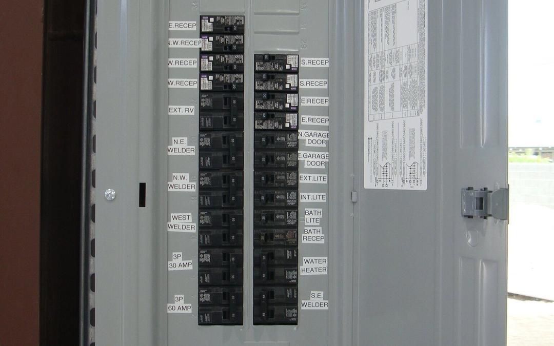 New breaker panel with neatly printed circuit labels including welder circuits
