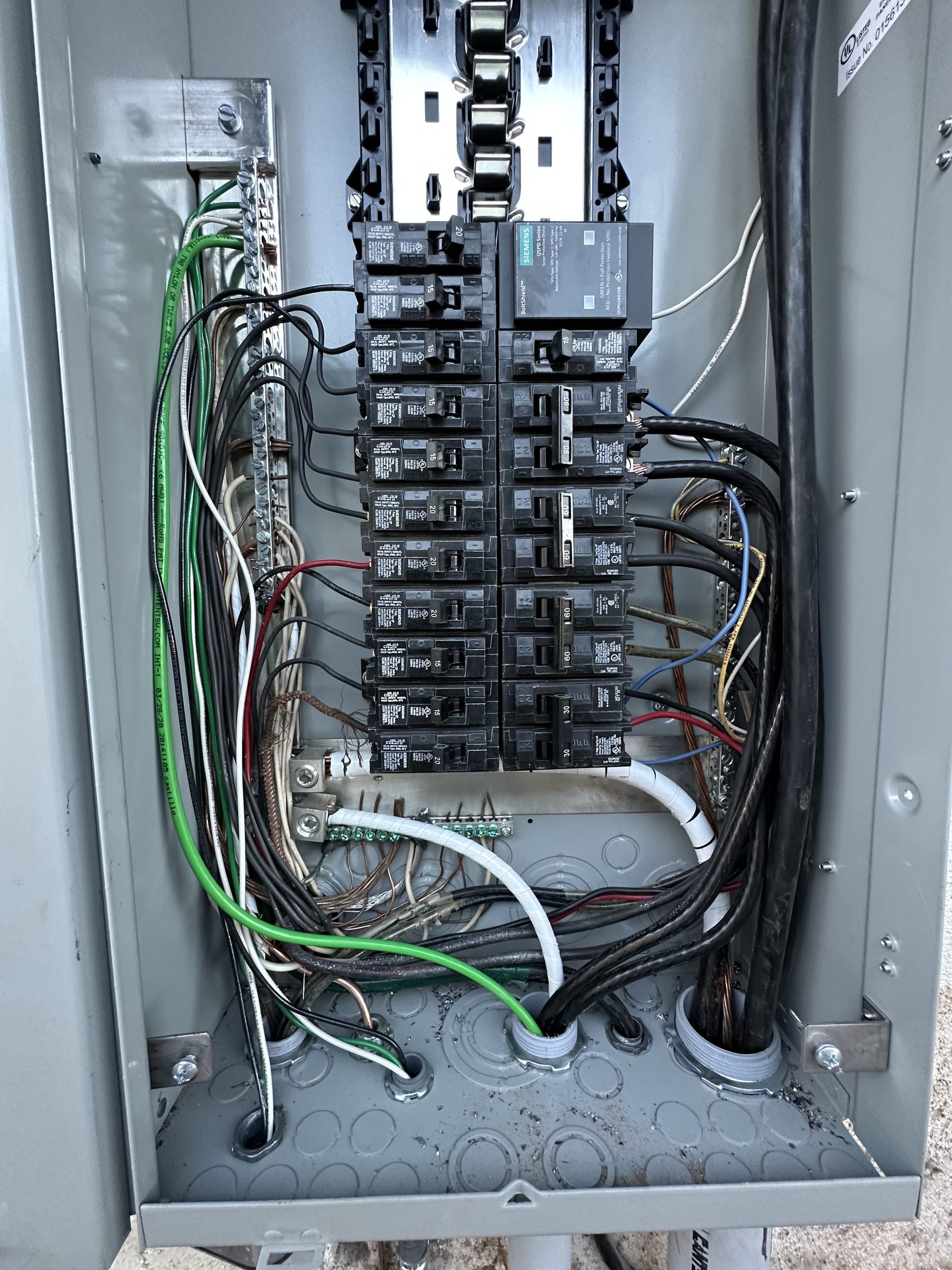 Interior of a new breaker panel with neatly routed wires