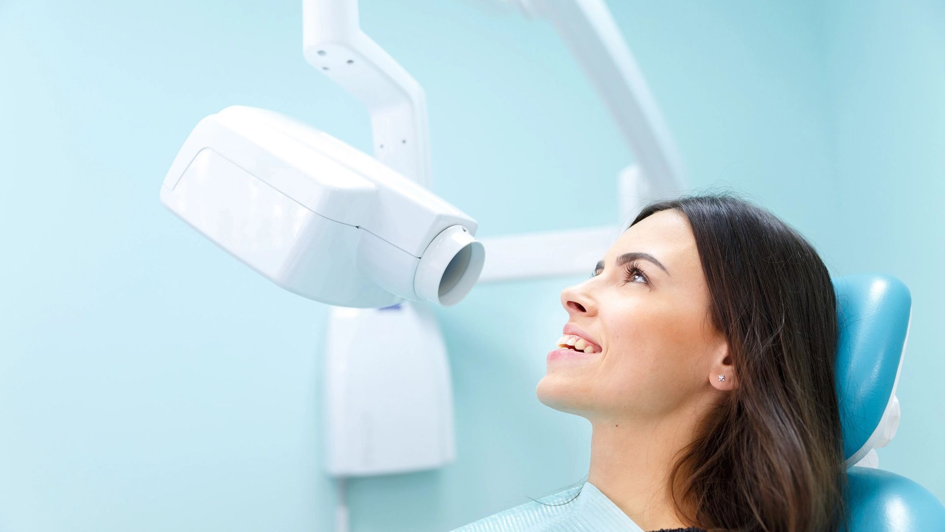 lady having mouth scanned in dentist