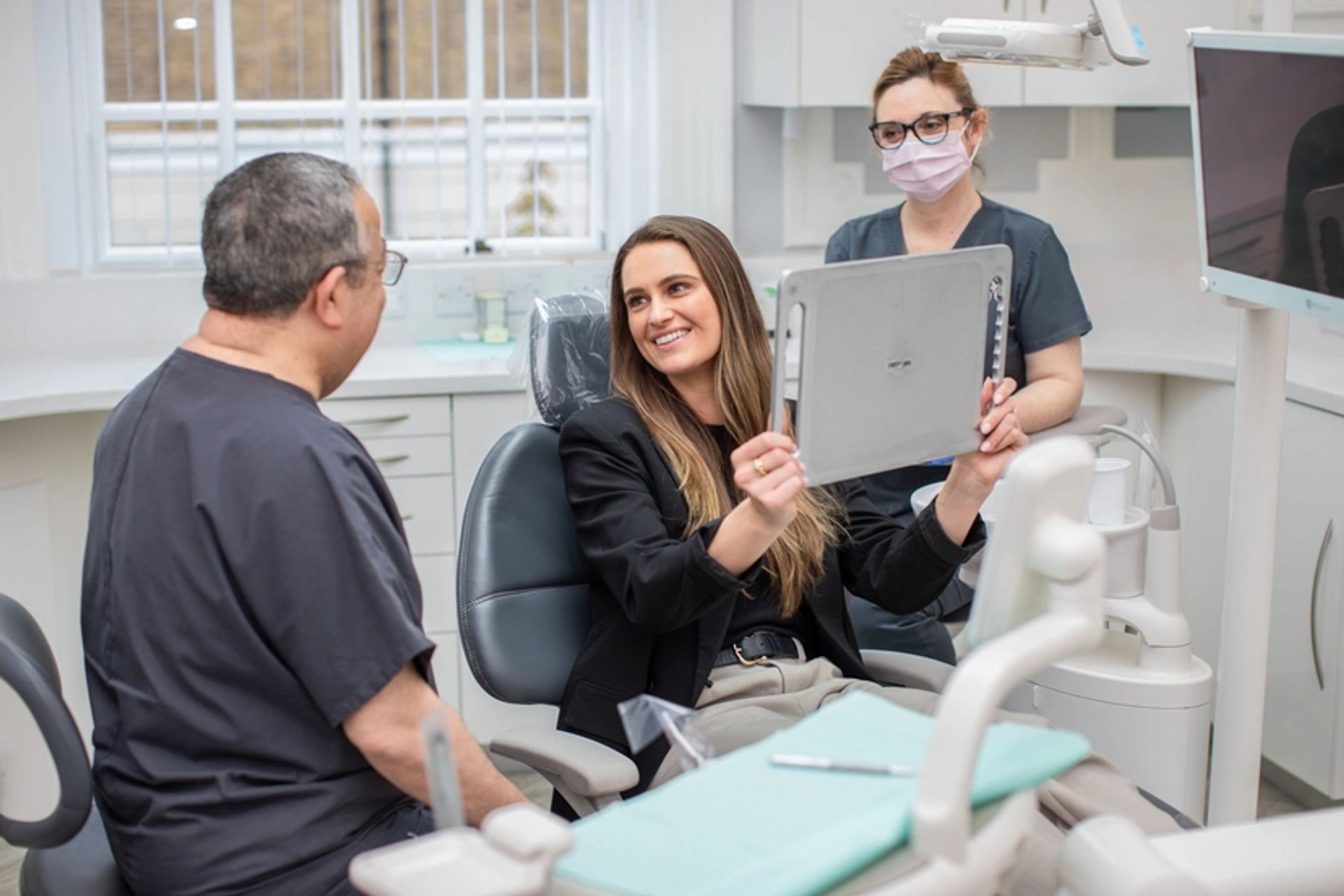 Image of dentist with patient