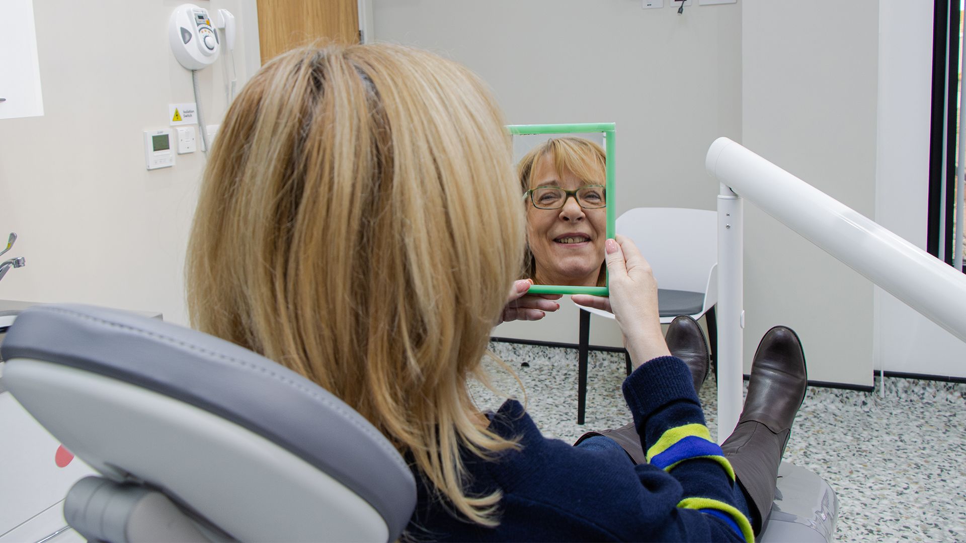 Patient looking in a mirror