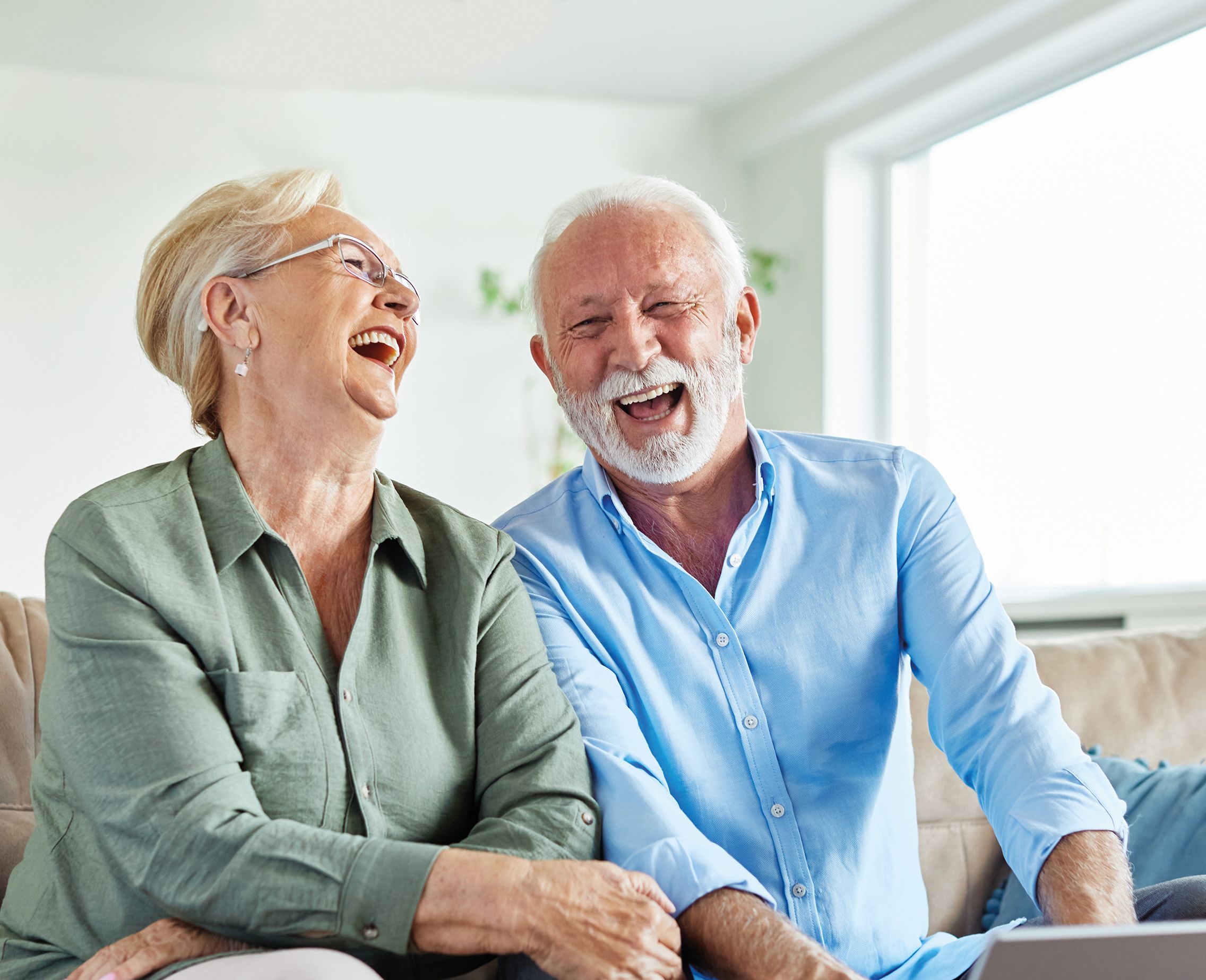 old man and woman laughing