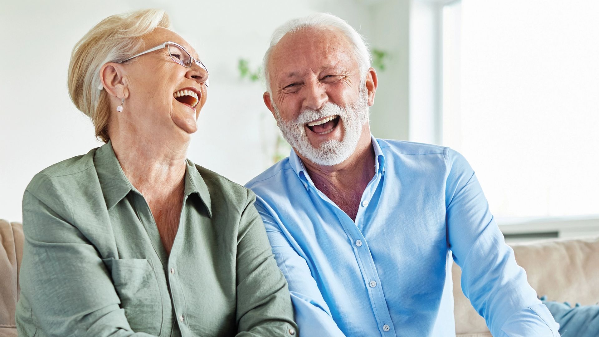 old man and woman laughing