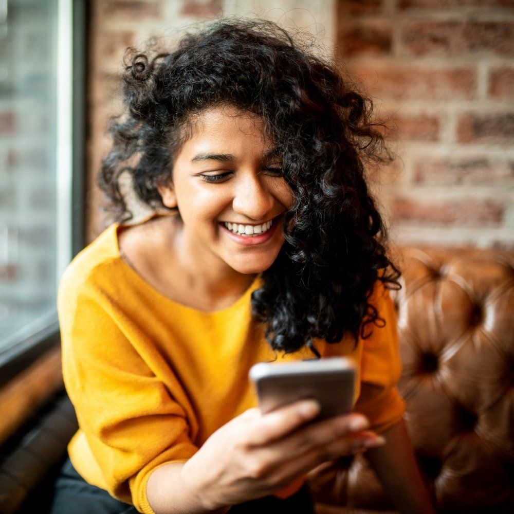 young-woman-smiling-on-phone