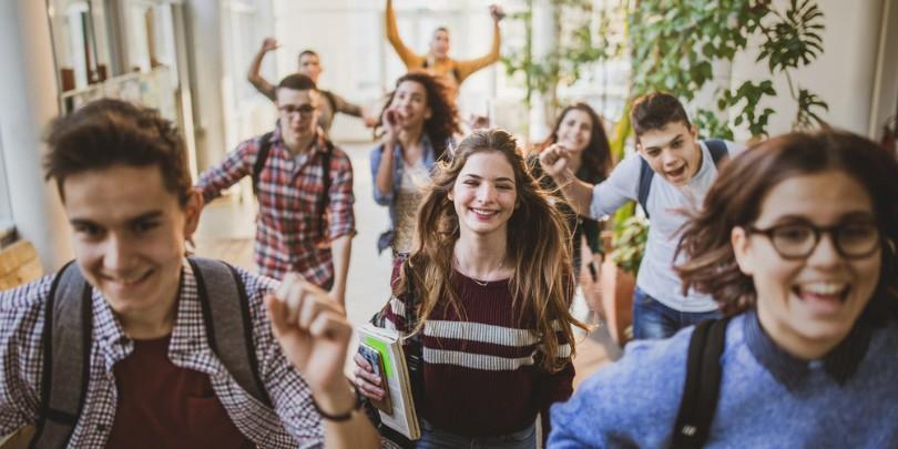 students excited running through halls