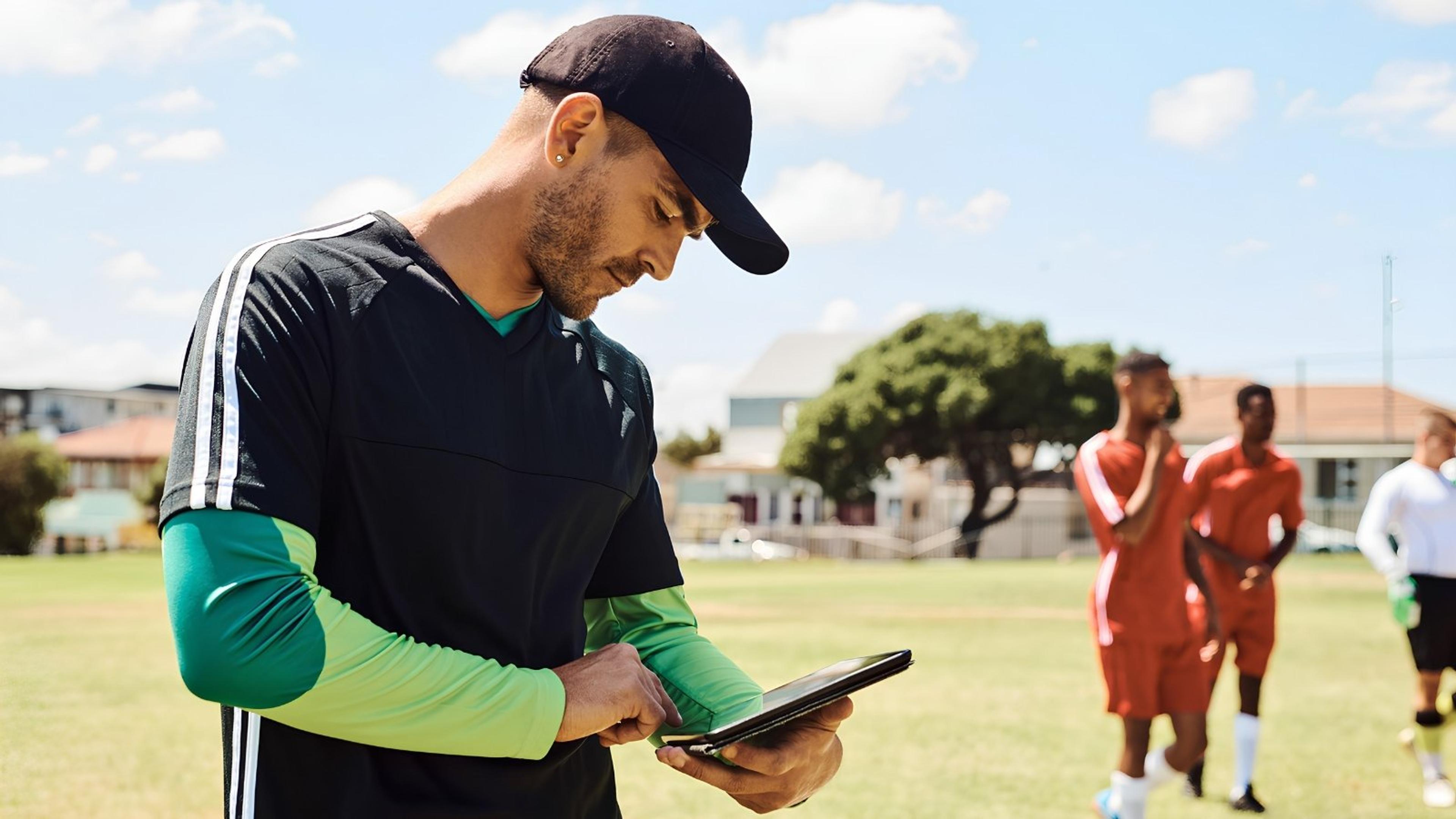 youth-sports-coach-planning-tablet
