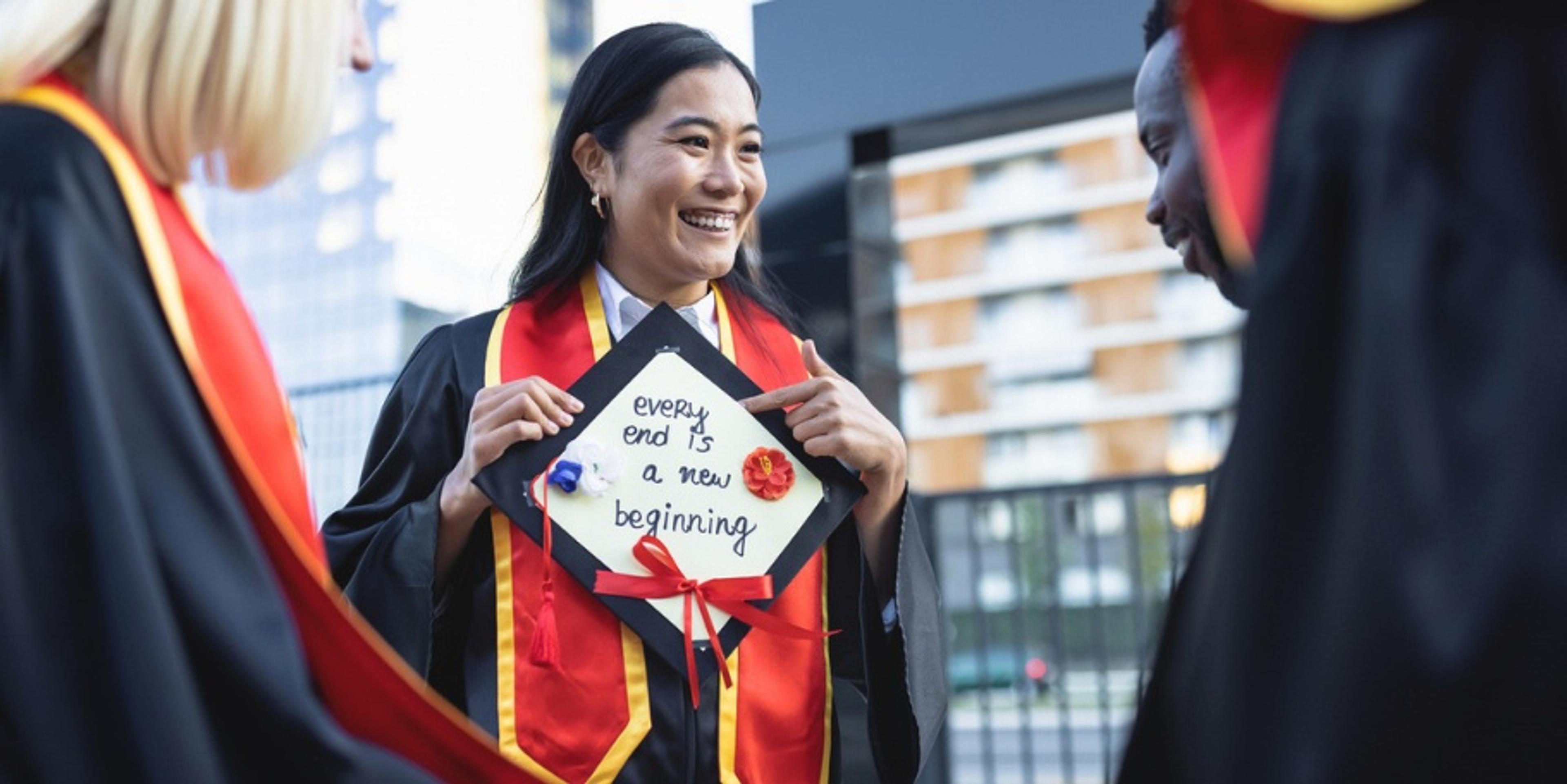 graduate reading card on cap