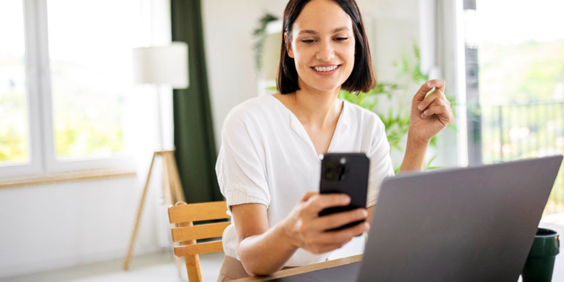 woman on laptop smiling