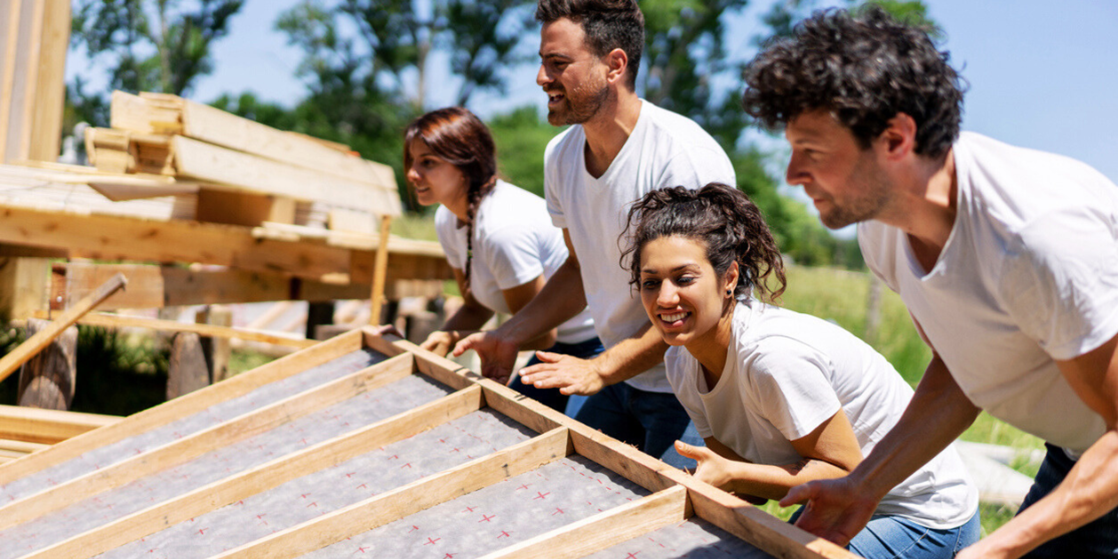 volunteers building house