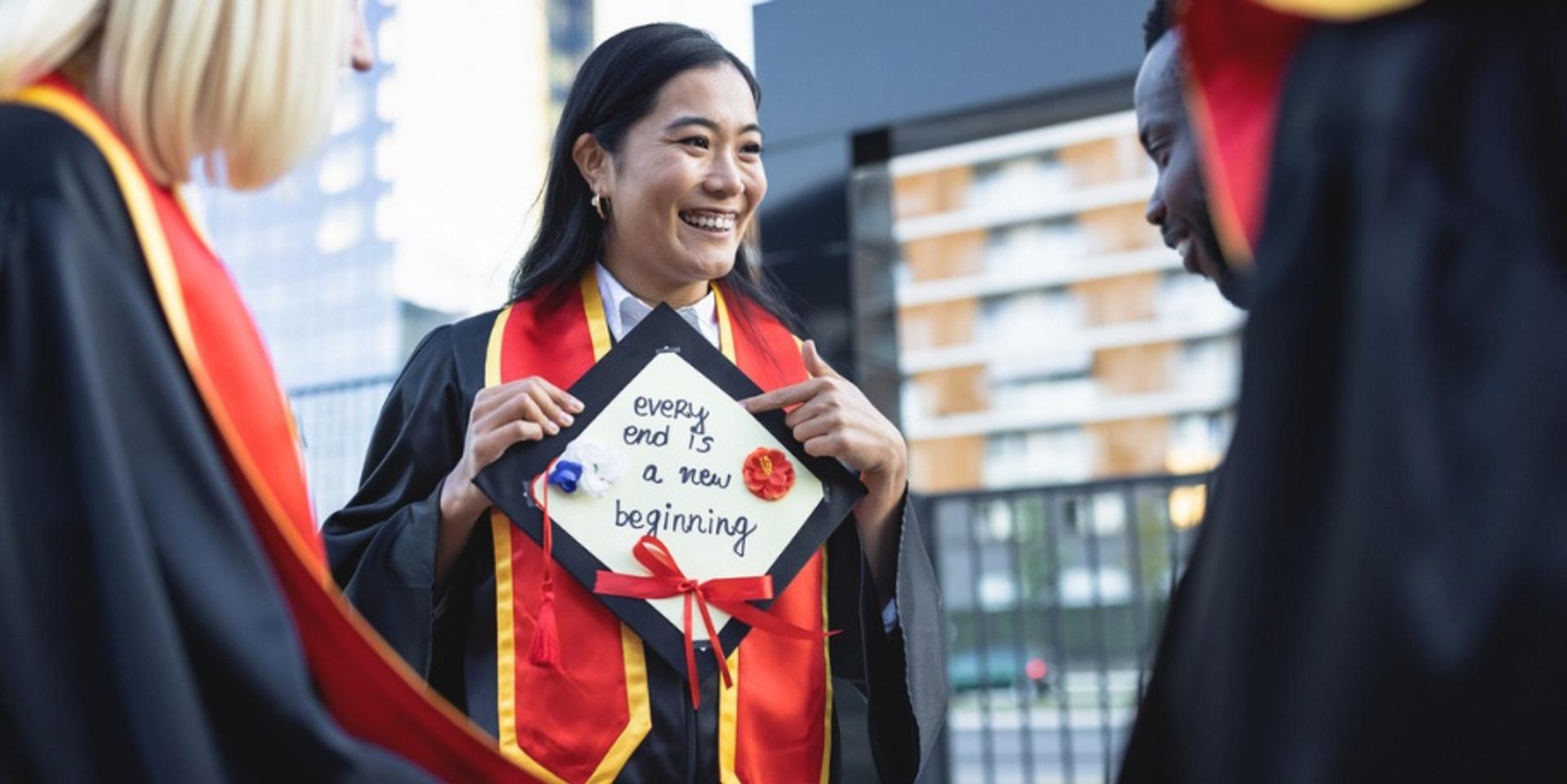 graduate reading card on cap