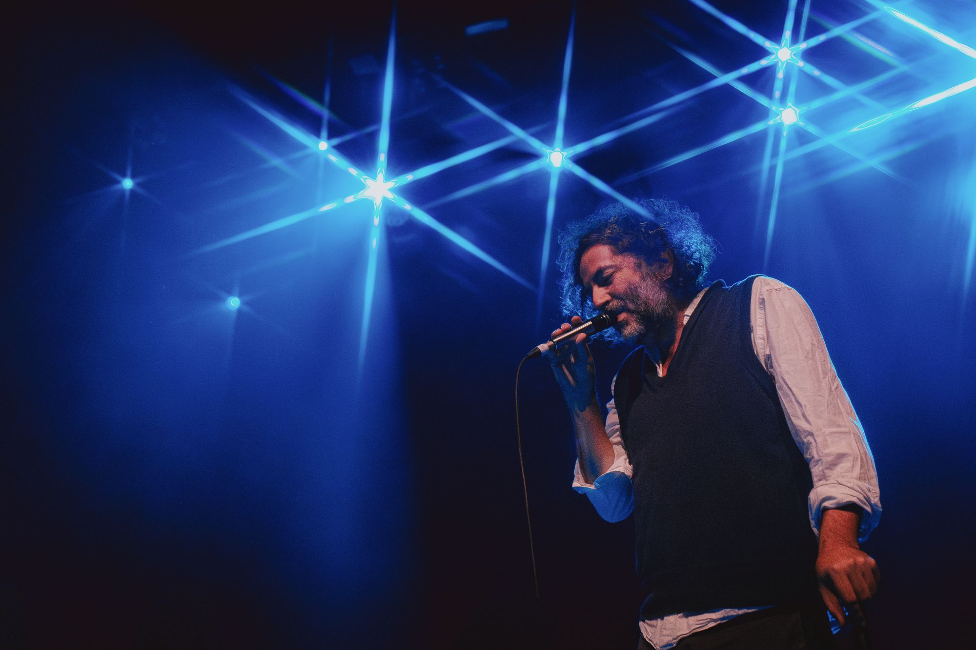 Dan Bejar of Destroyer singing lead vocals in front of a packed Vogue Theatre in Vancouver on Oct 26th 2025 concluding the Dan's Boogie tour.