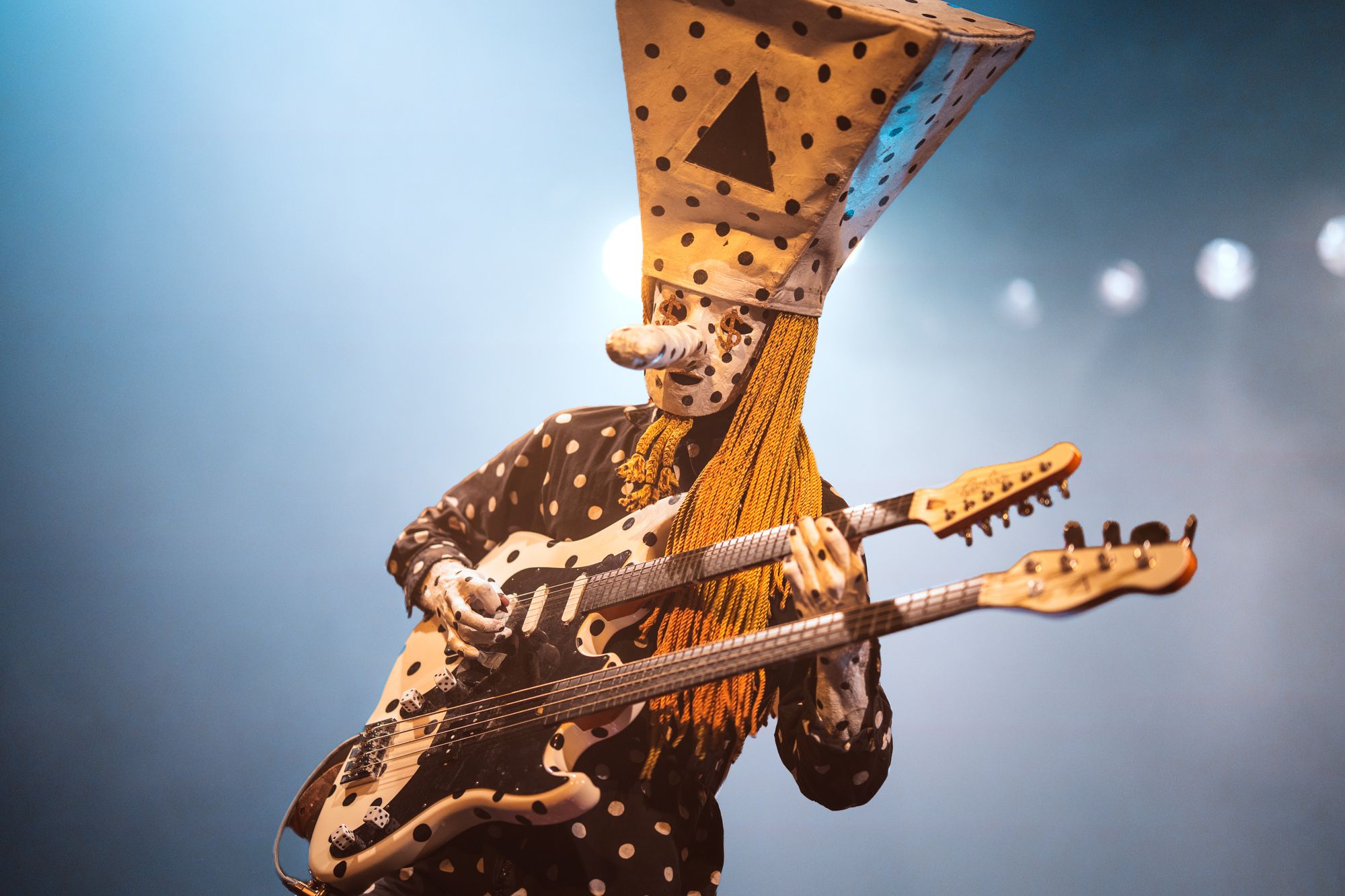 Guitarist Khn de Poitrine playing his signature double neck microtonal guitar