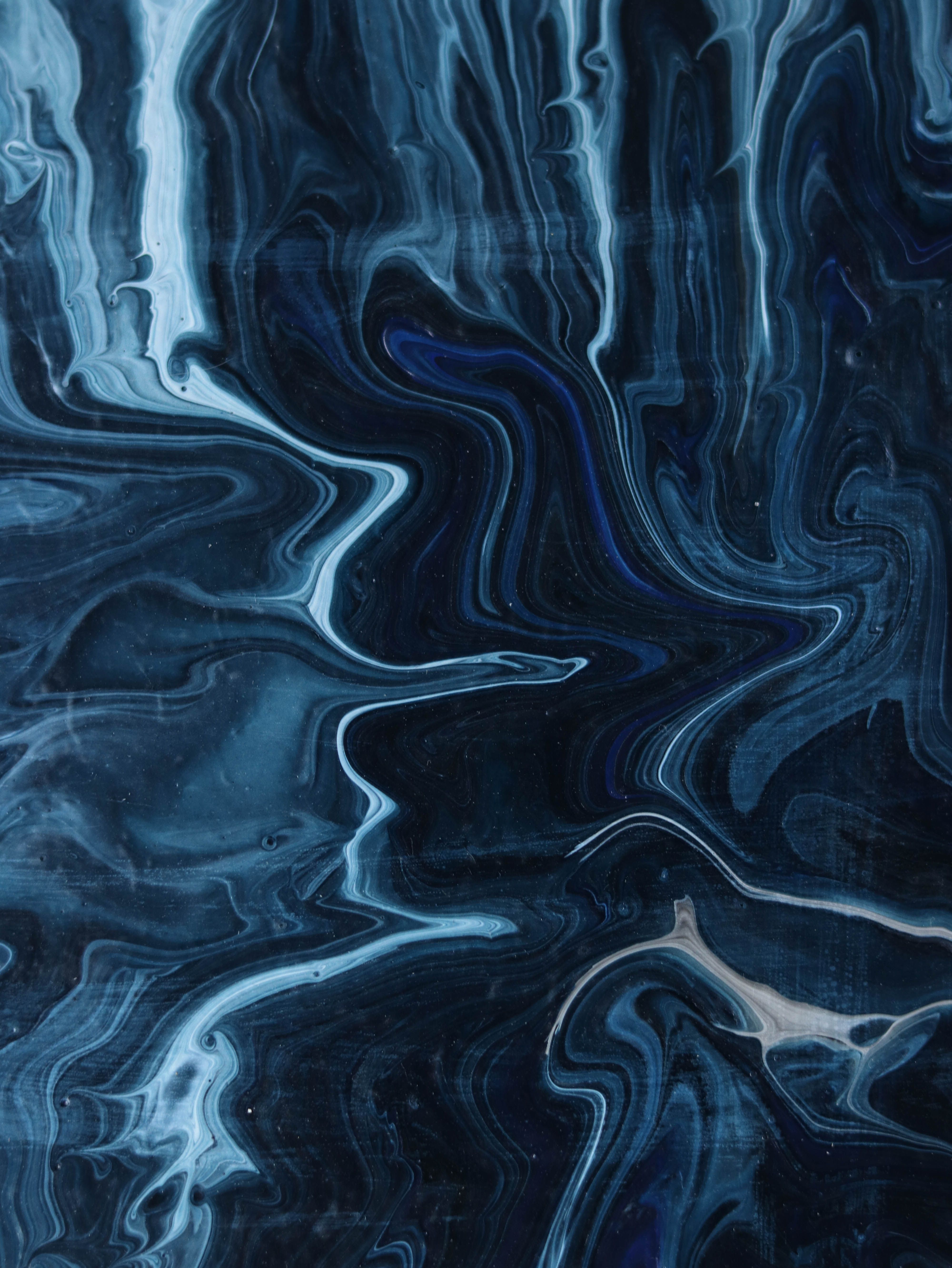 Abstract navy and pale blue marbled paint