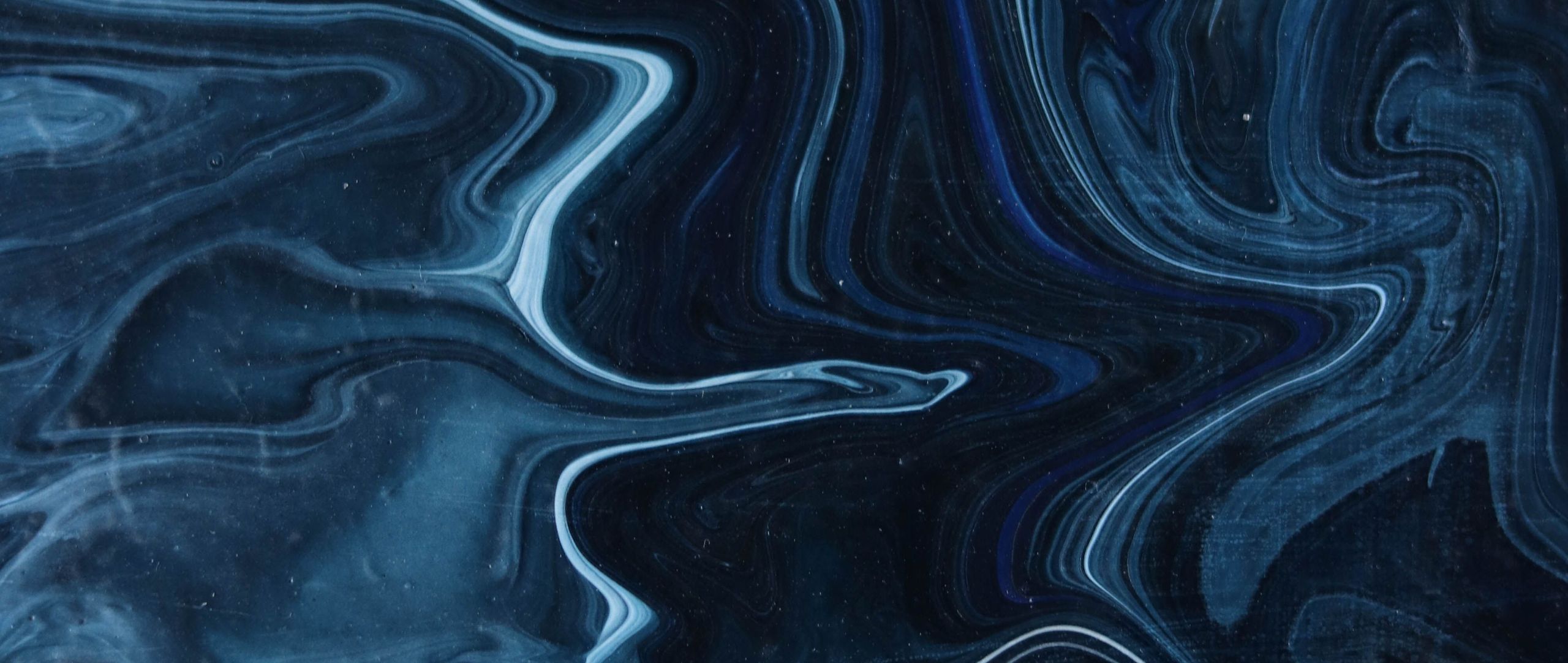 Abstract navy and pale blue marbled paint