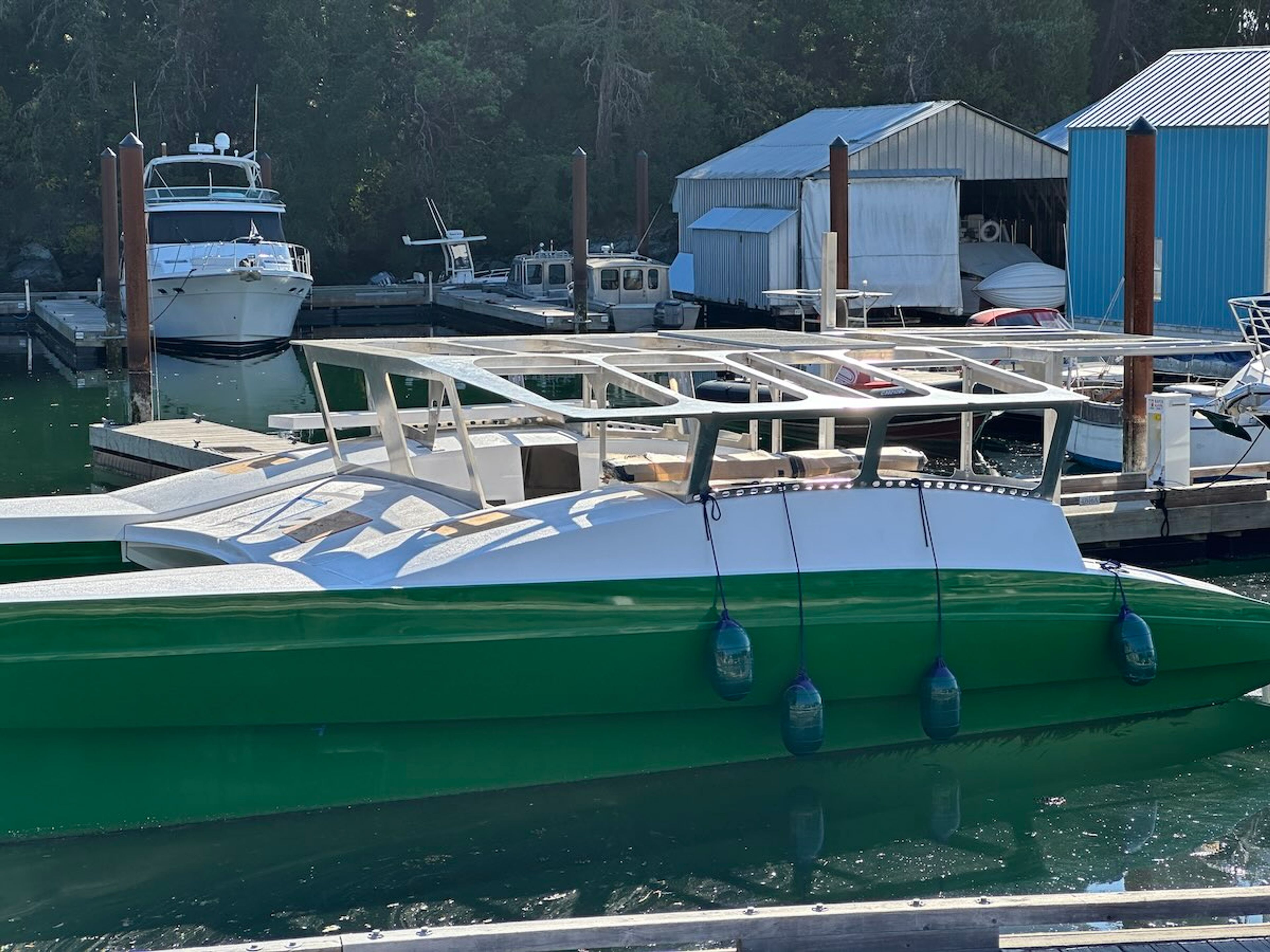 photo of Catalyst at a dock showing no solar panels attached to the aluminum structure