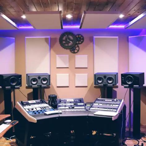 Picture of a recording studio with speakers.