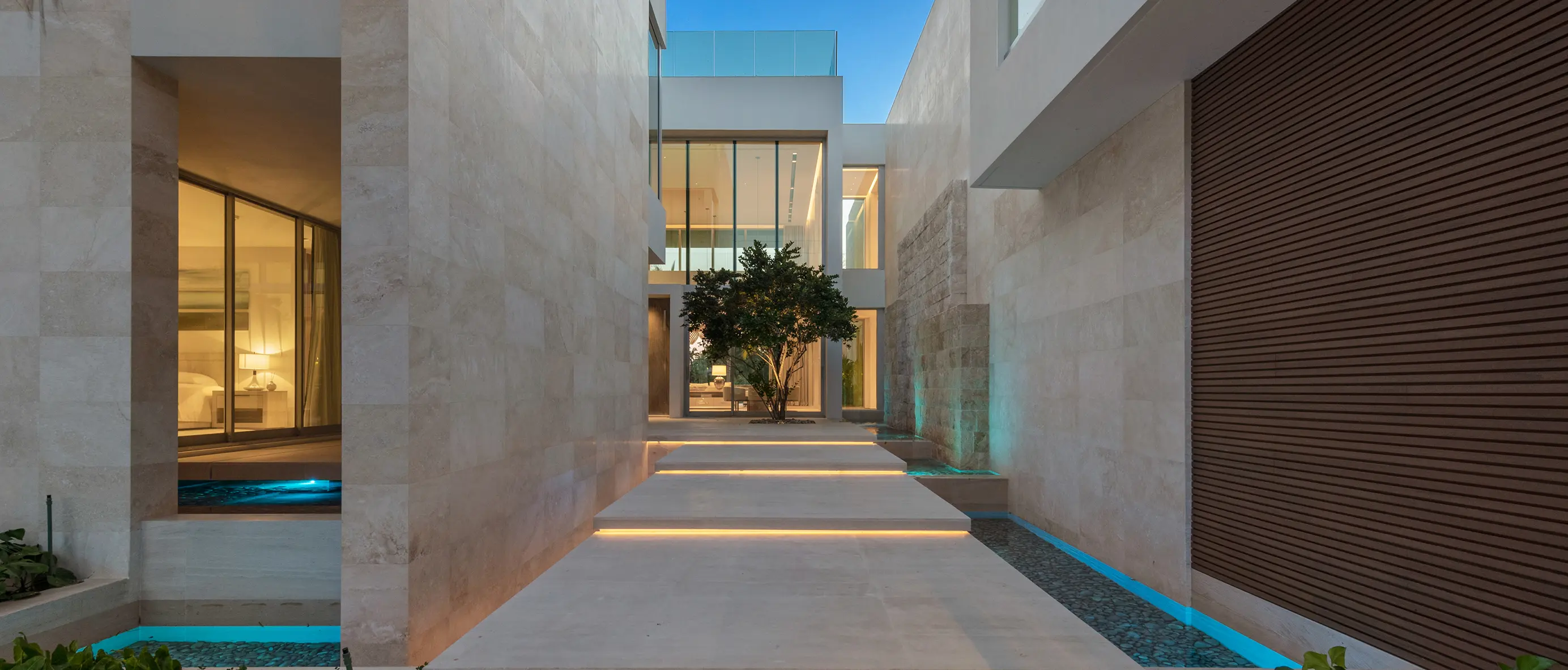 Grand entrance foyer with soaring ceilings, designer lighting, and modern architectural details