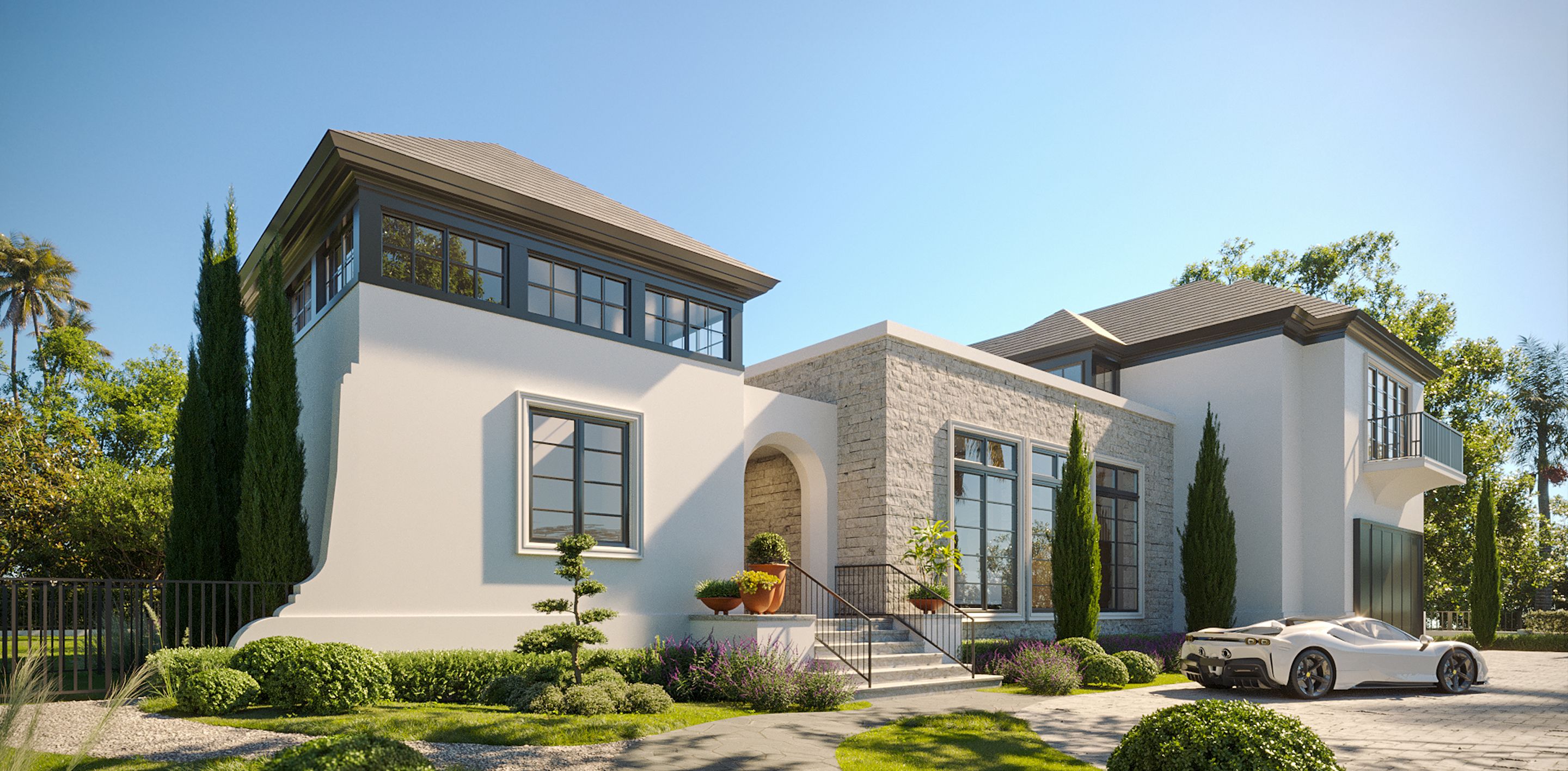 Elegant Mediterranean-inspired estate with white stucco exterior, stone accents, arched entrance, and manicured landscaping in Miami