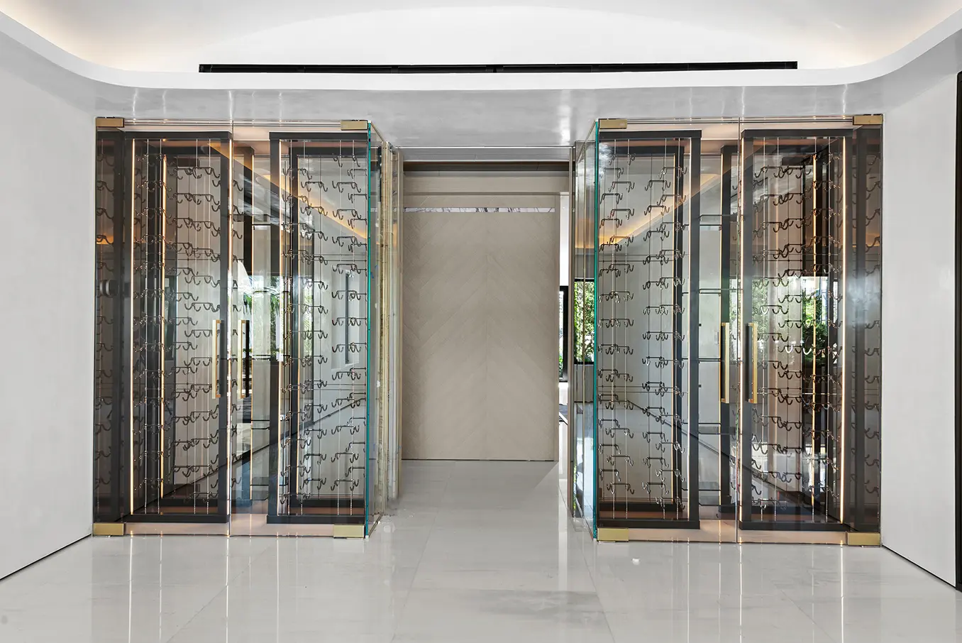 Climate-controlled wine cellar with custom wooden storage and ambient lighting for wine collection