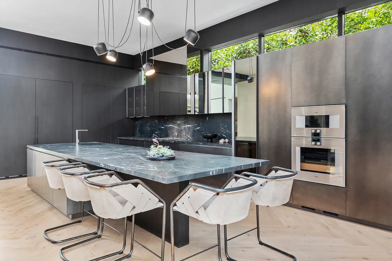 Spacious open kitchen and dining area with contemporary design and seamless indoor-outdoor flow