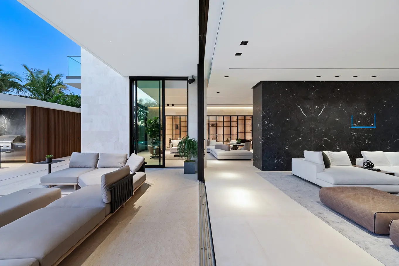 Split view showcasing covered outdoor patio, modern poolhouse, and elegant interior living spaces