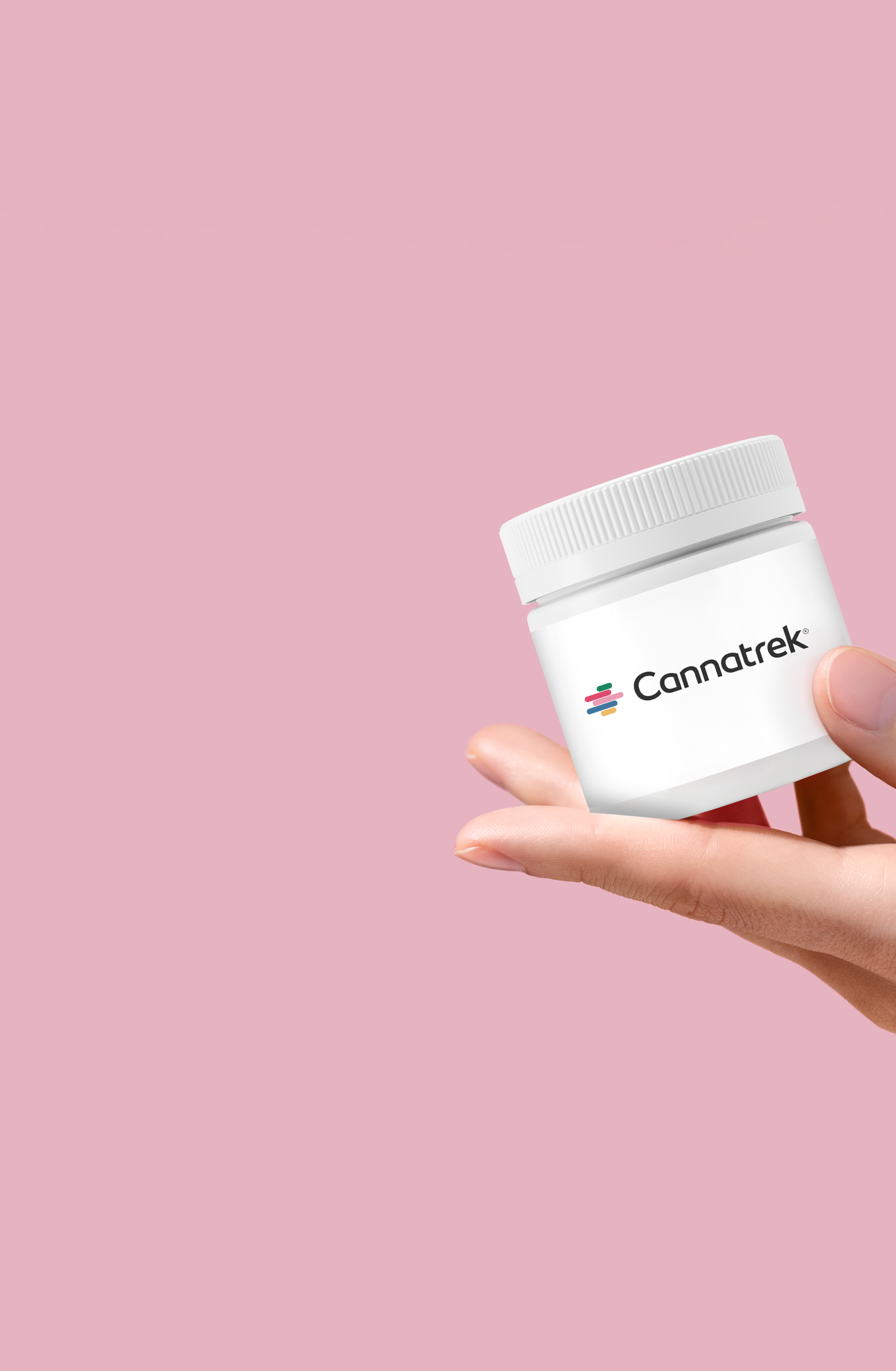 A hand holding a container labelled with "Cannatrek".