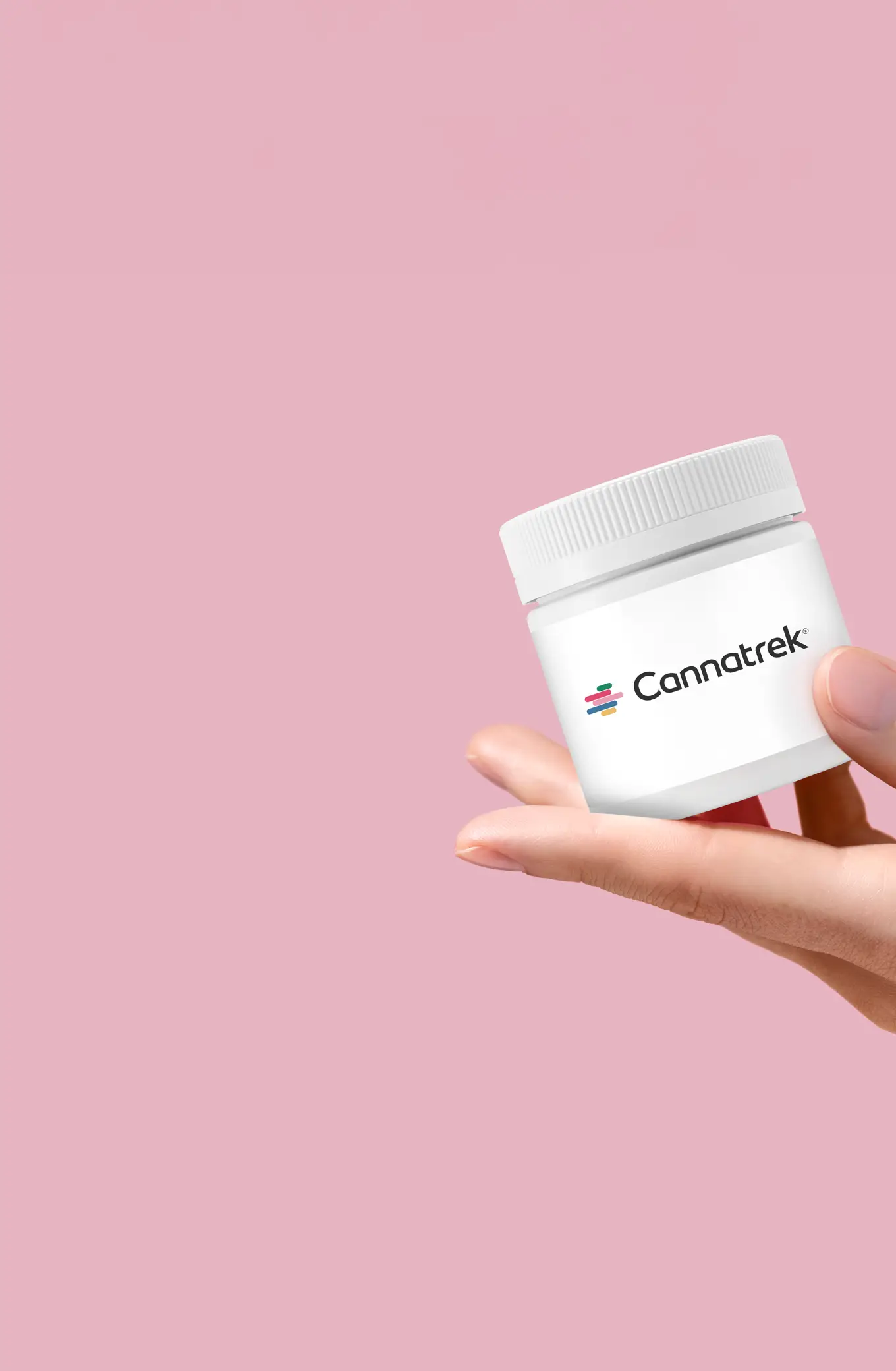 A hand holding a container labelled with "Cannatrek".