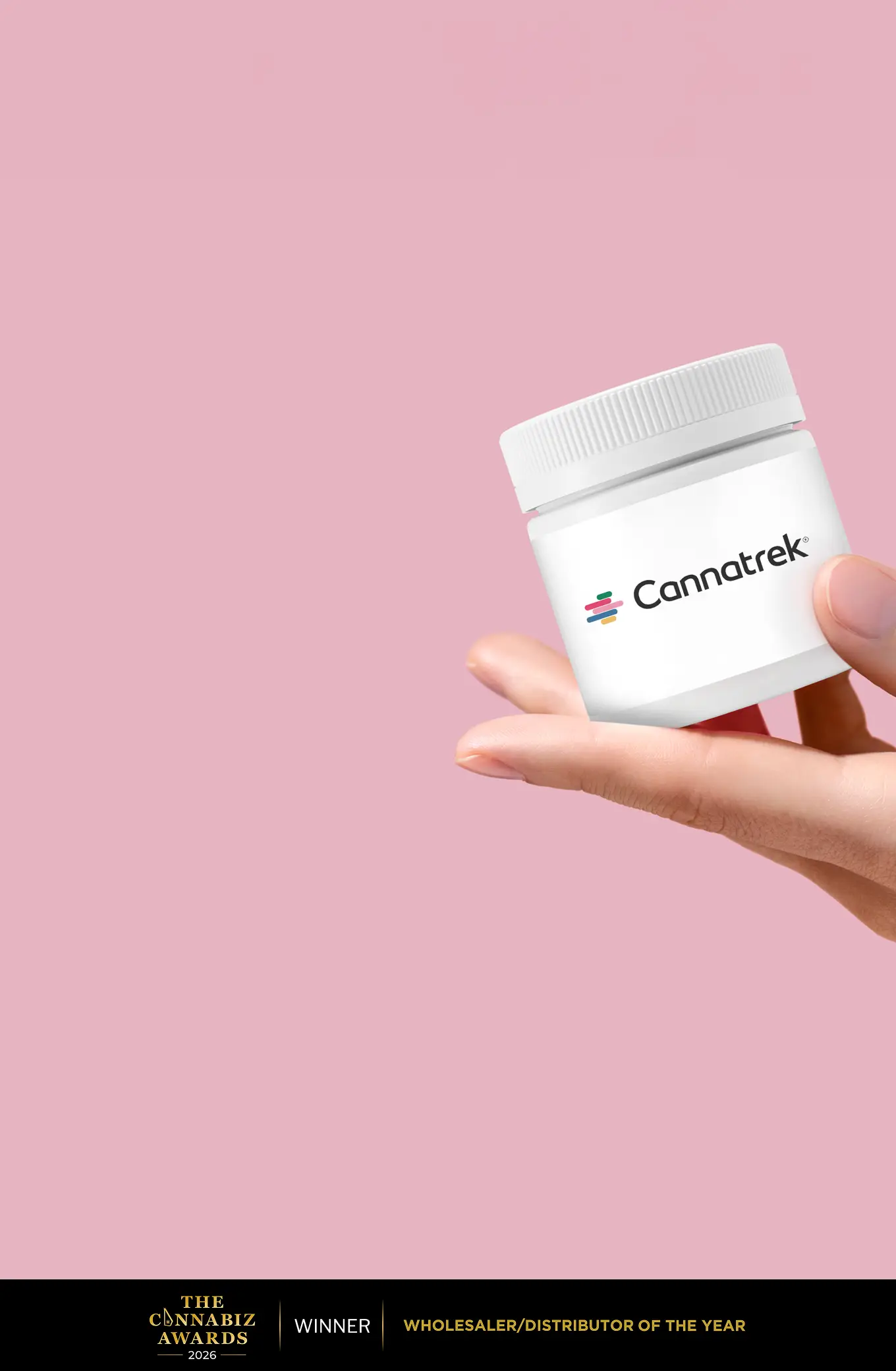 A hand holding a container labelled with "Cannatrek".