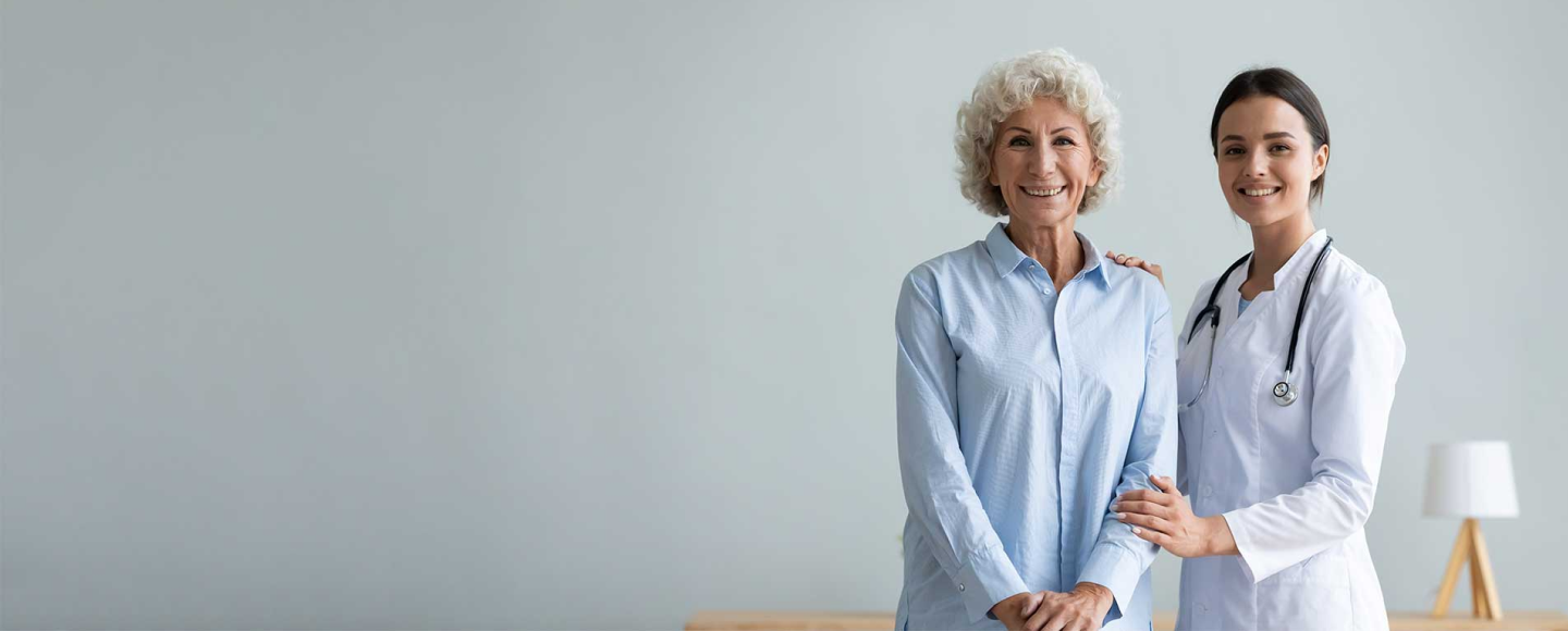 Doctor and a patient standing together.