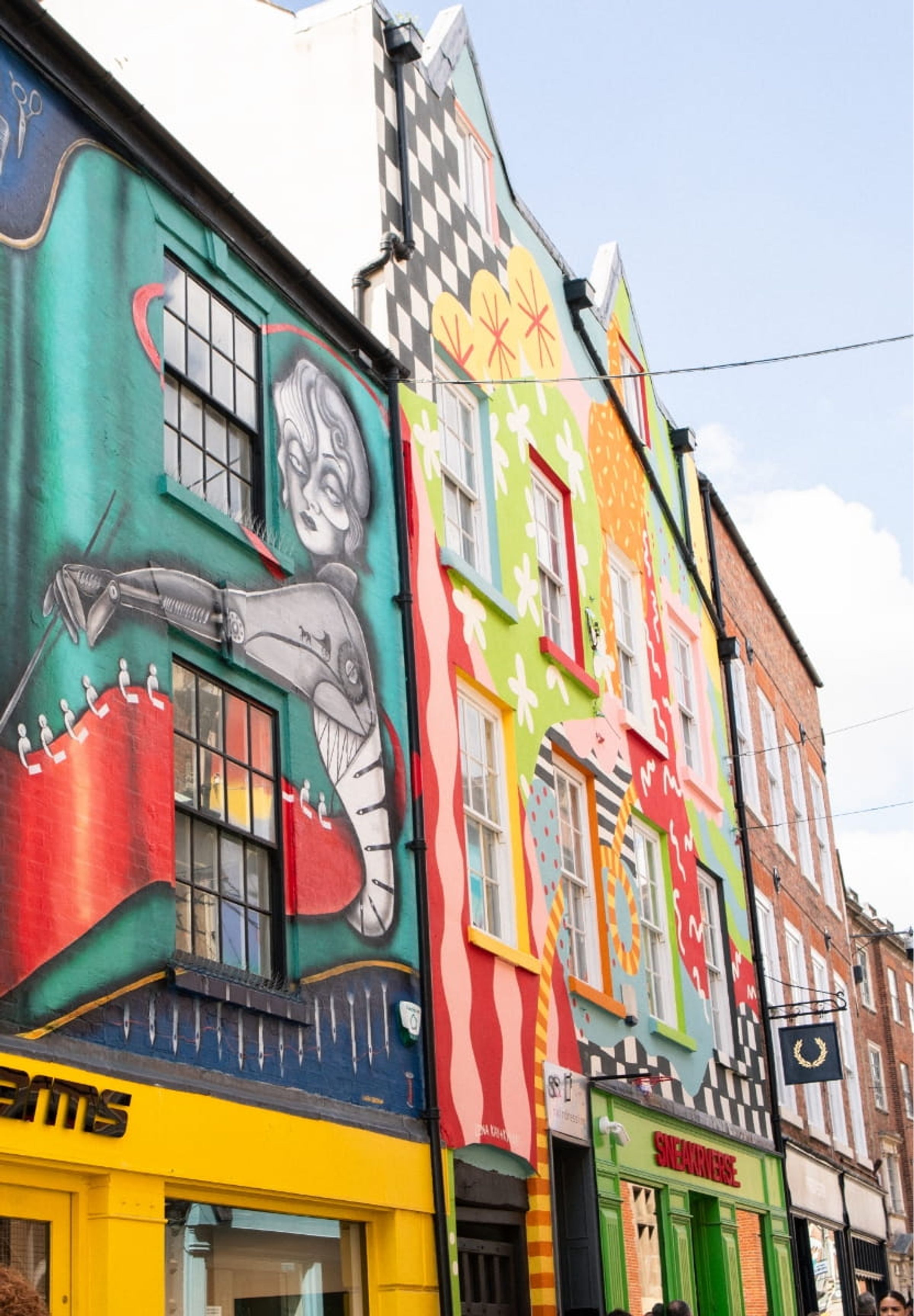 Bright murals above the shops in Bridlesmith Gate, Nottingham