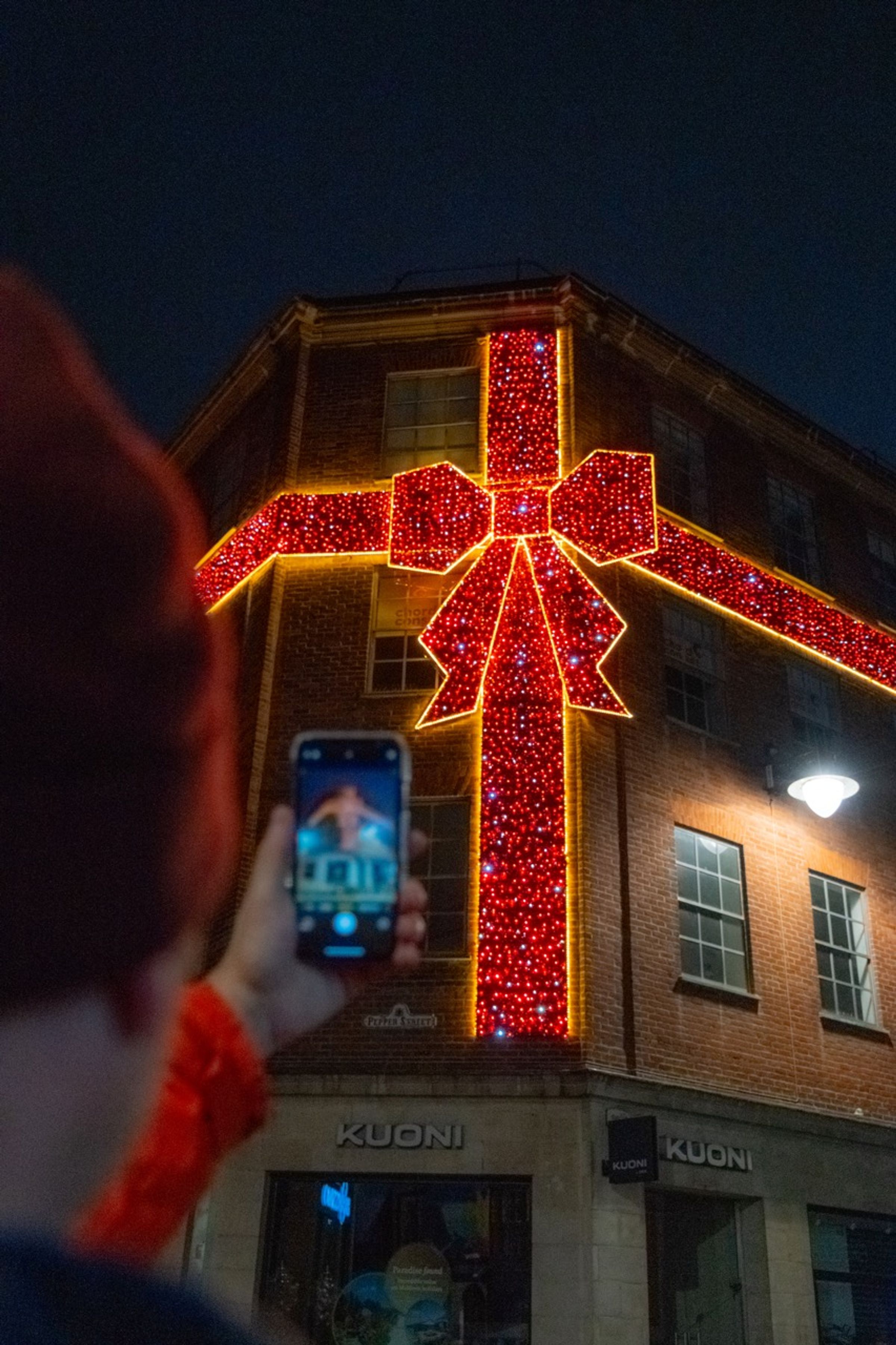 Nottingham's Big Red Bow lit up on Bridlesmith House