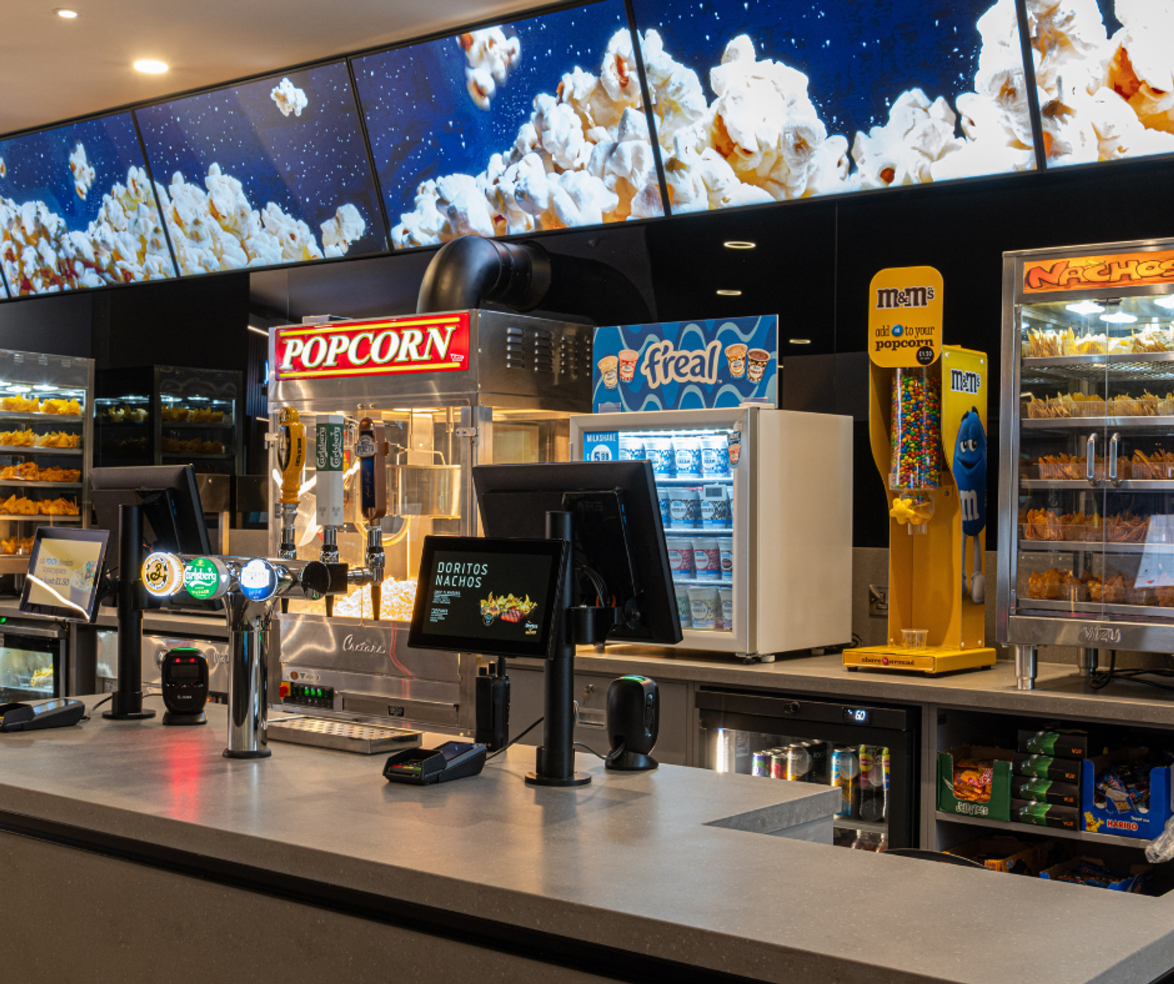 The snack bar at Vue Cinema Nottingham, with popcorn, nachos, m&m and f'real serving cabinets.