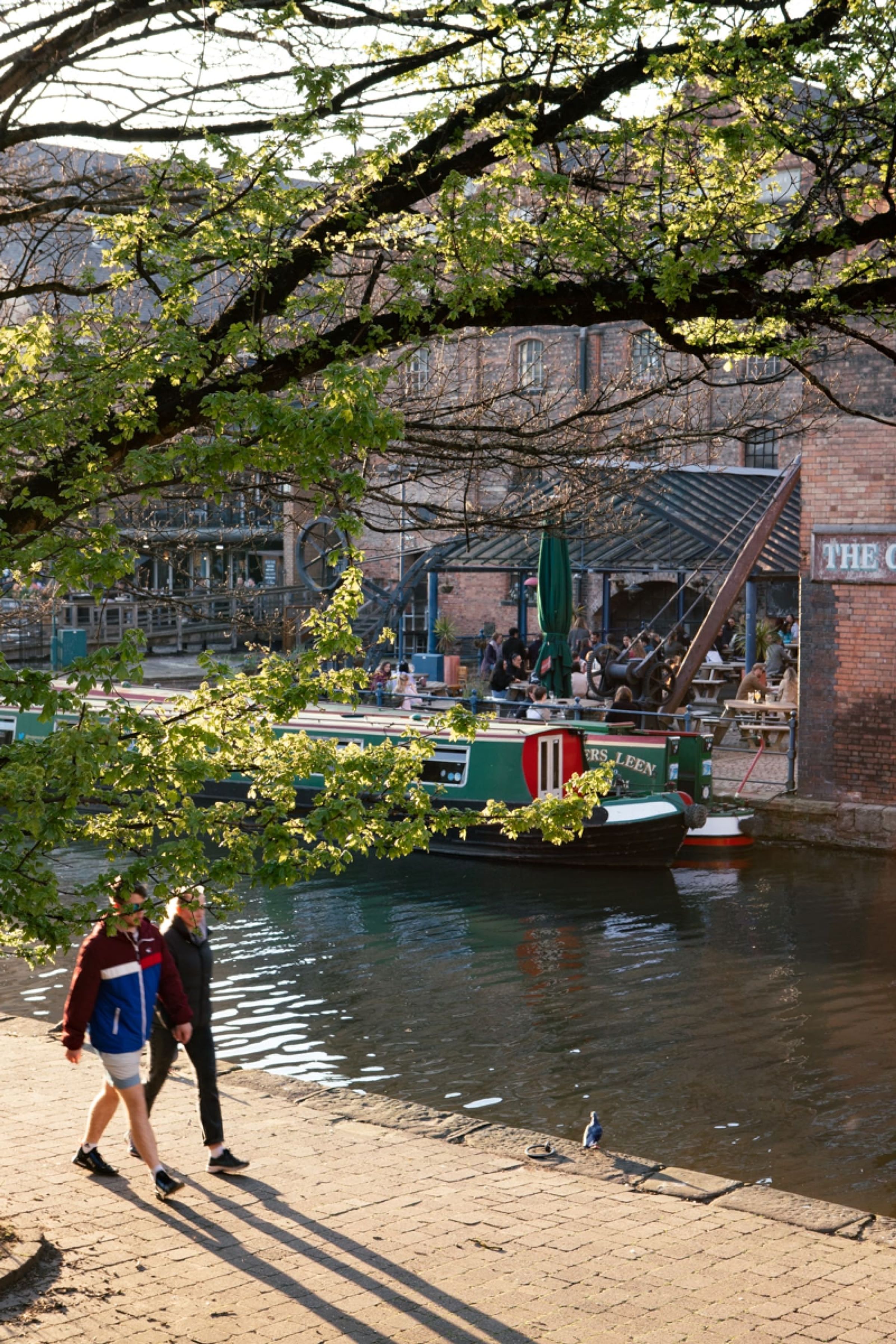 Couple walking alongside canal