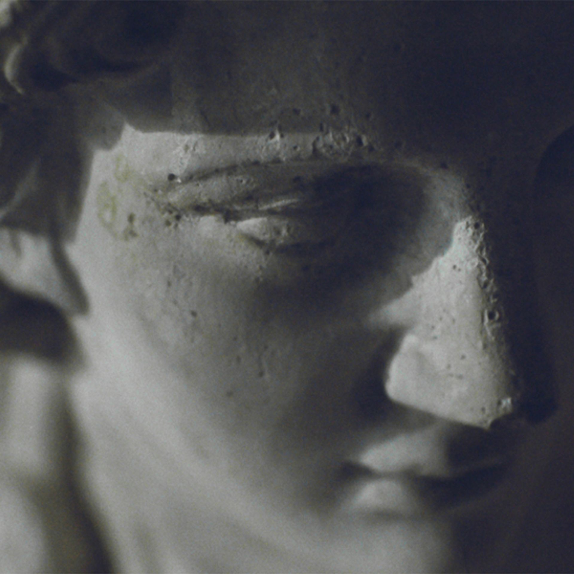 Classical marble sculpture of a face in soft light — skincare for combination skin for men by Apollon Studios