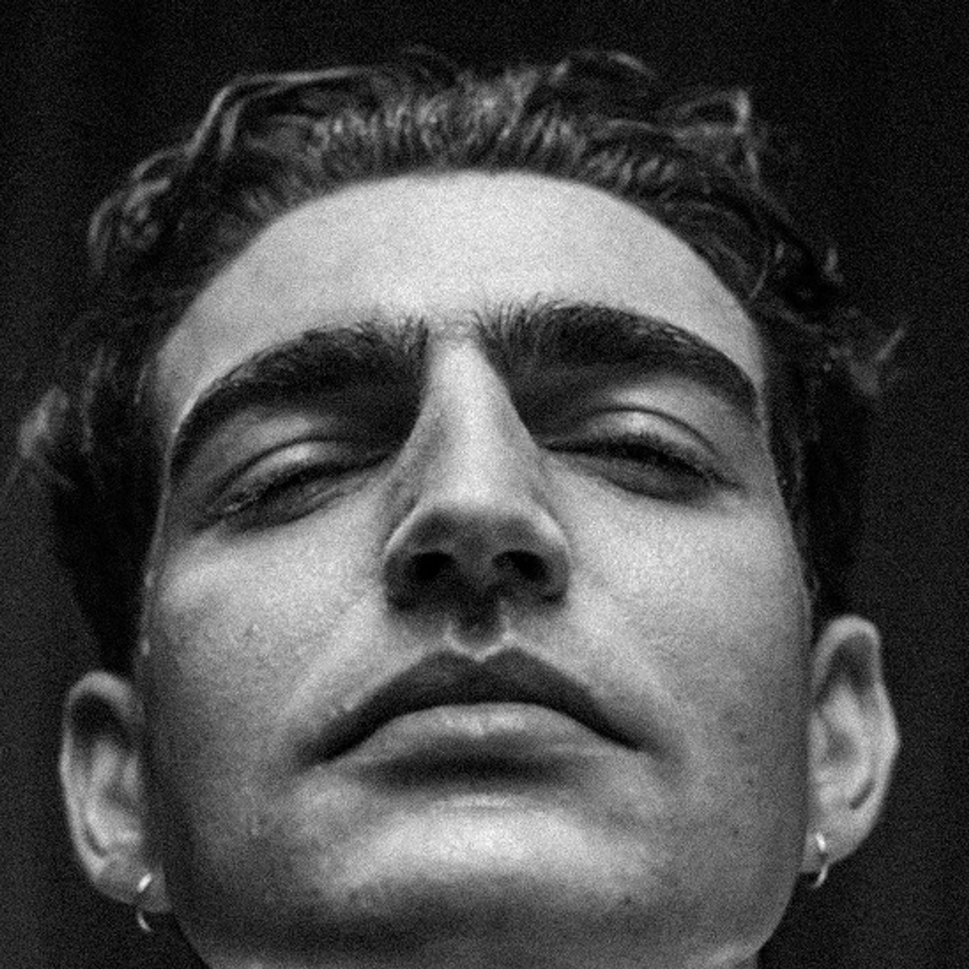 Close-up portrait of a man with visible skin texture — natural men's skincare by Apollon Studios