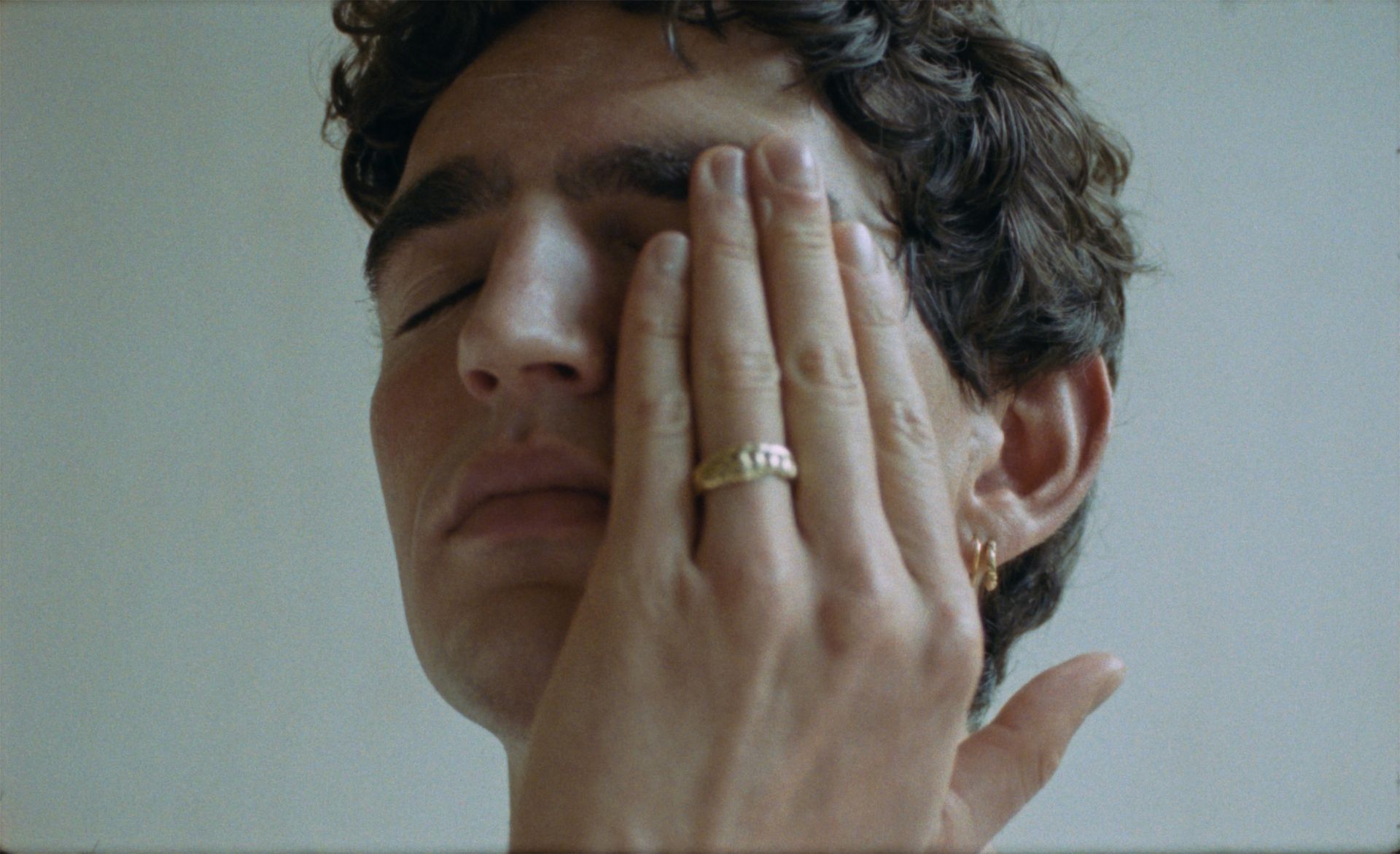 "A man applying Apollon Studios Face Cream, showcasing deep hydration and skin repair."