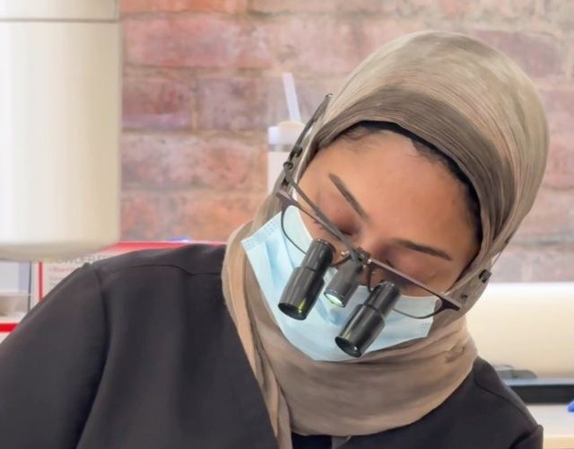 Dr Zoya Ahmed carrying out detailed dental work