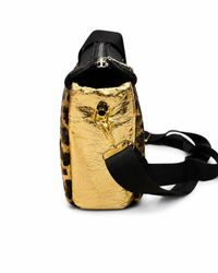Elysian bag side view showing metallic gold crinkled panel