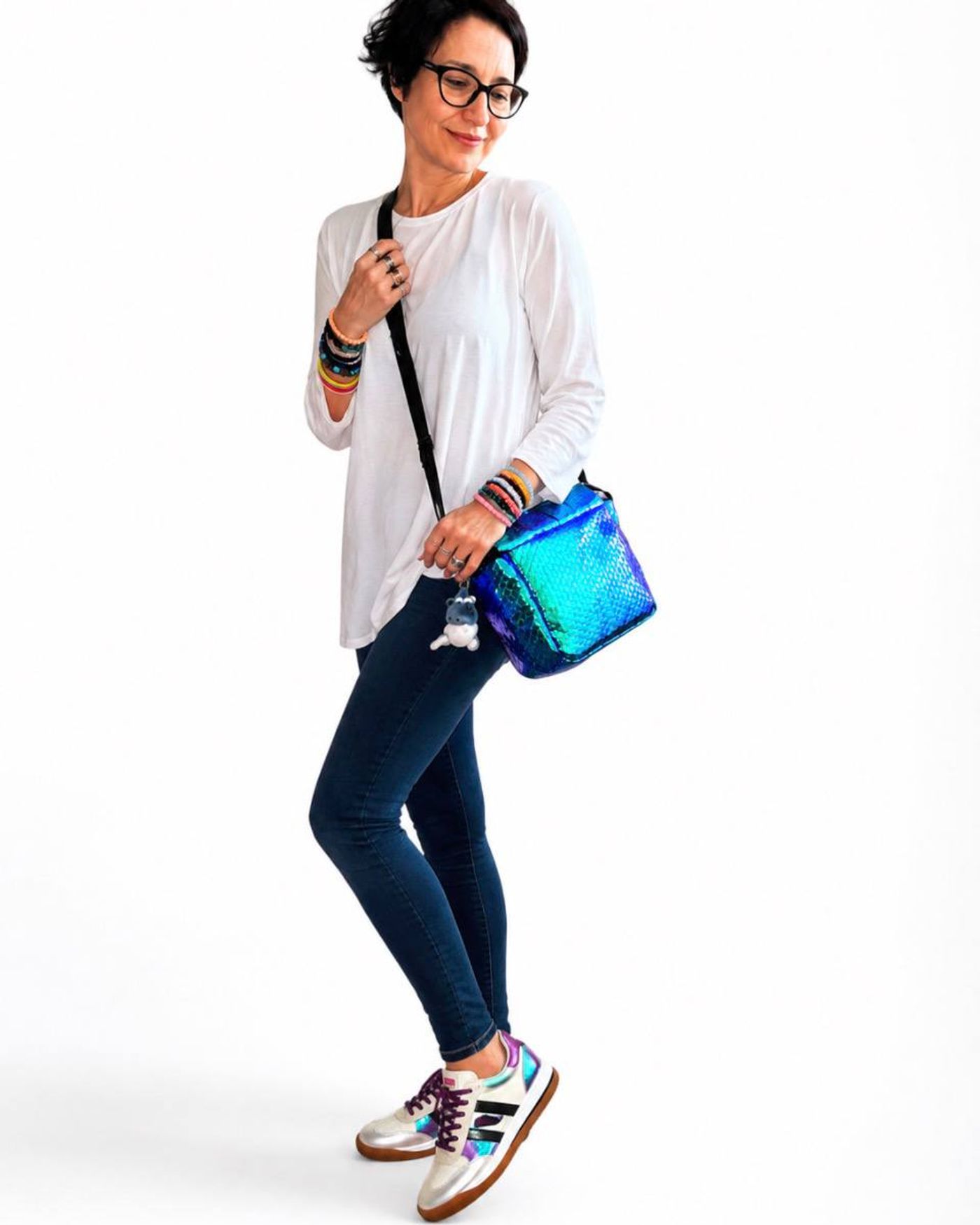 Iris — iridescent blue crossbody bag worn by Irena, ODDANA