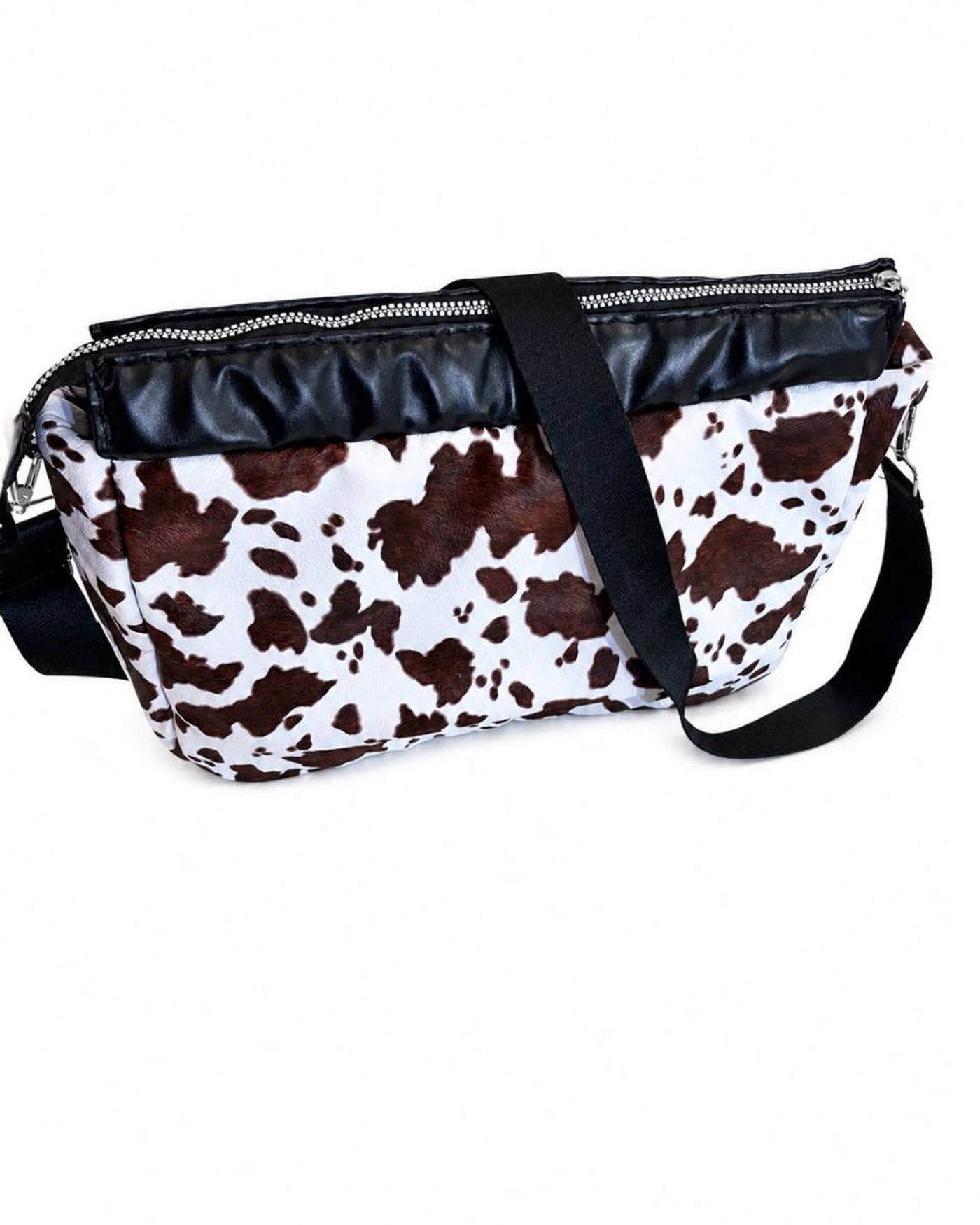 Savanna cow print crossbody bag - front view with bold pattern