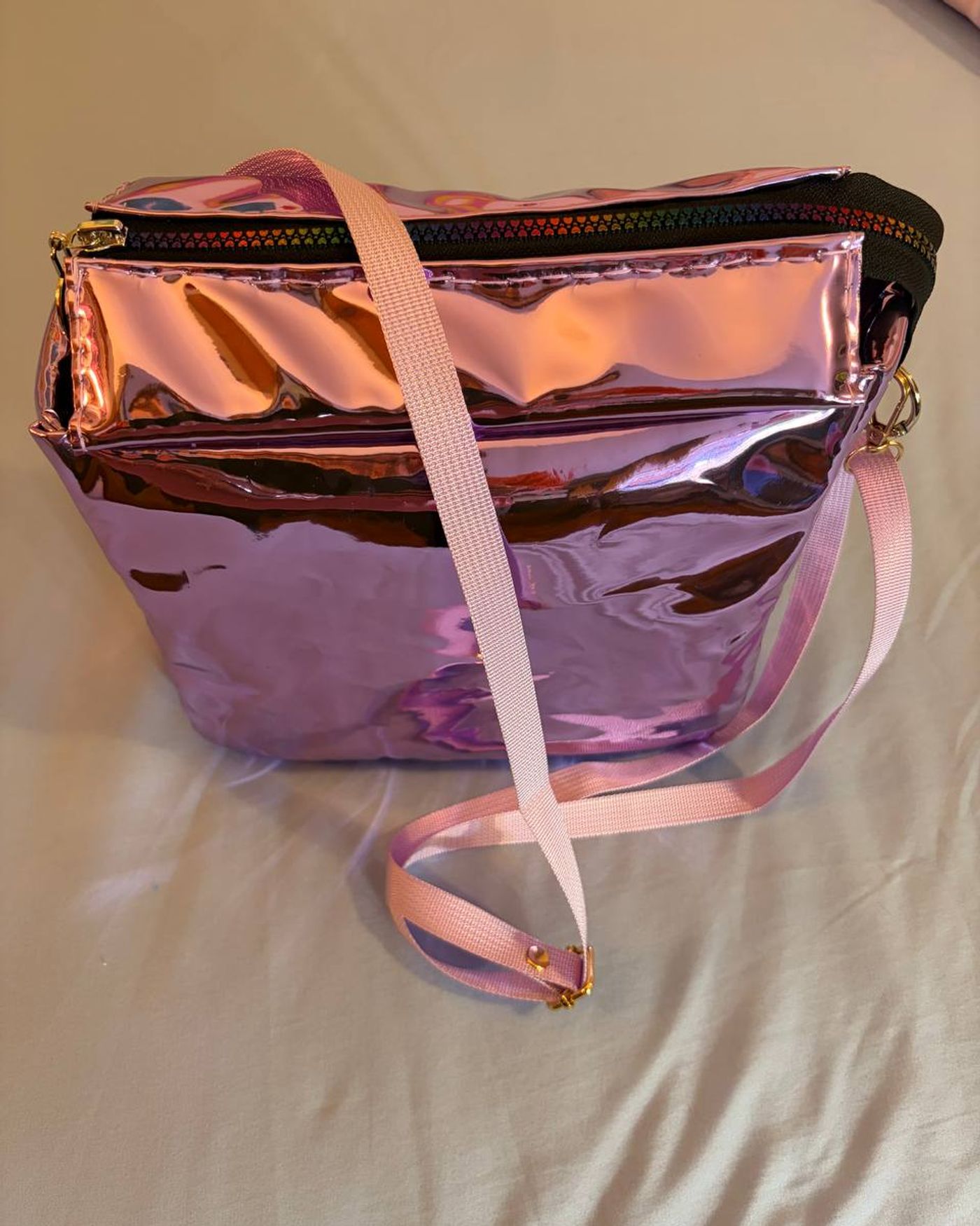 Aurora holographic pink crossbody bag - front view with rainbow heart zipper