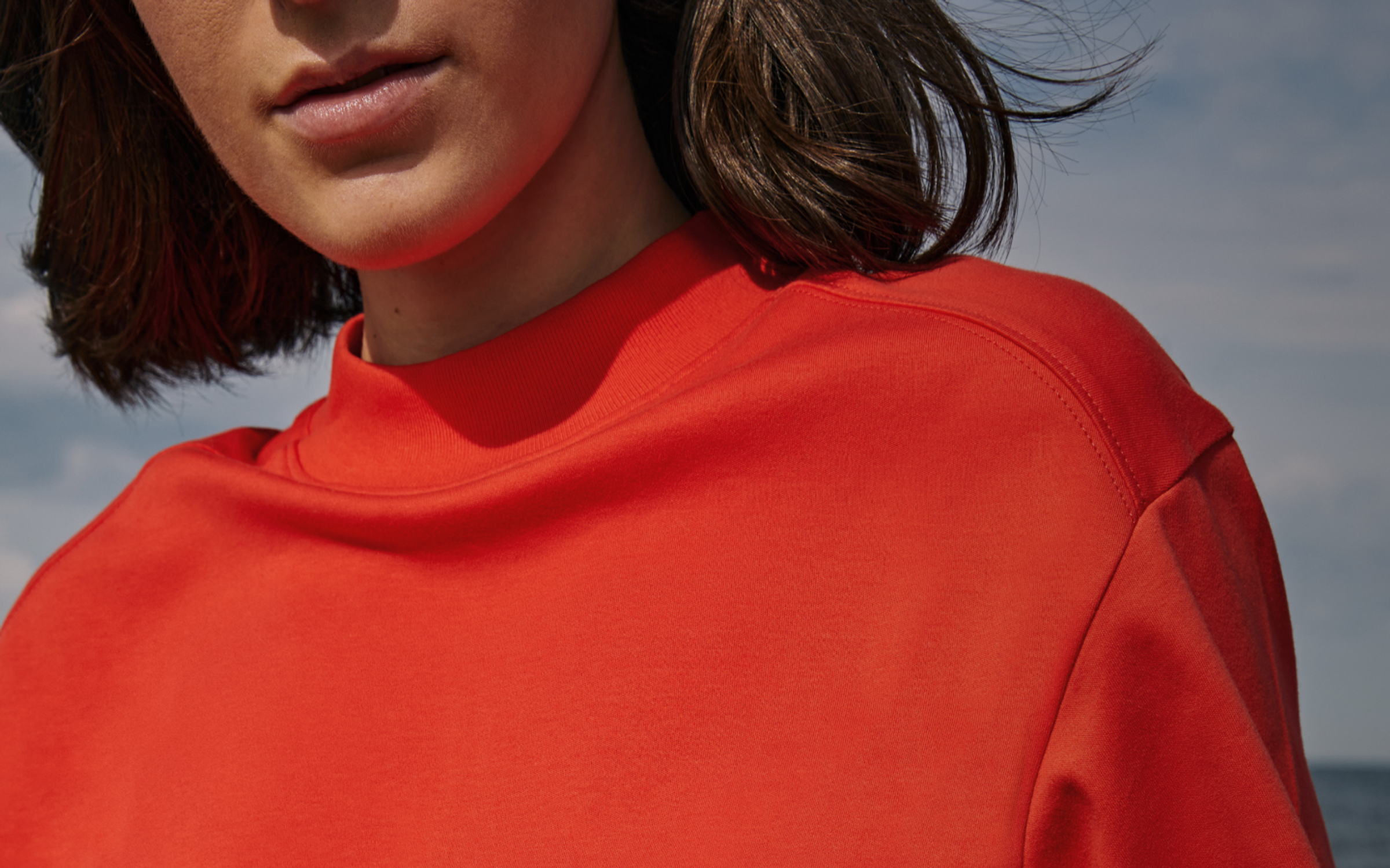 Woman in orange shirt